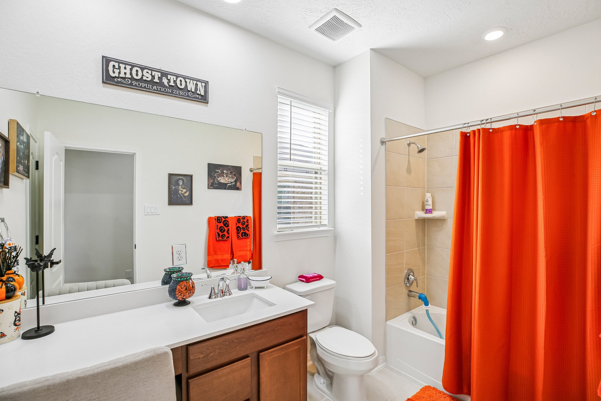 secondary bathroom has a vanity area.