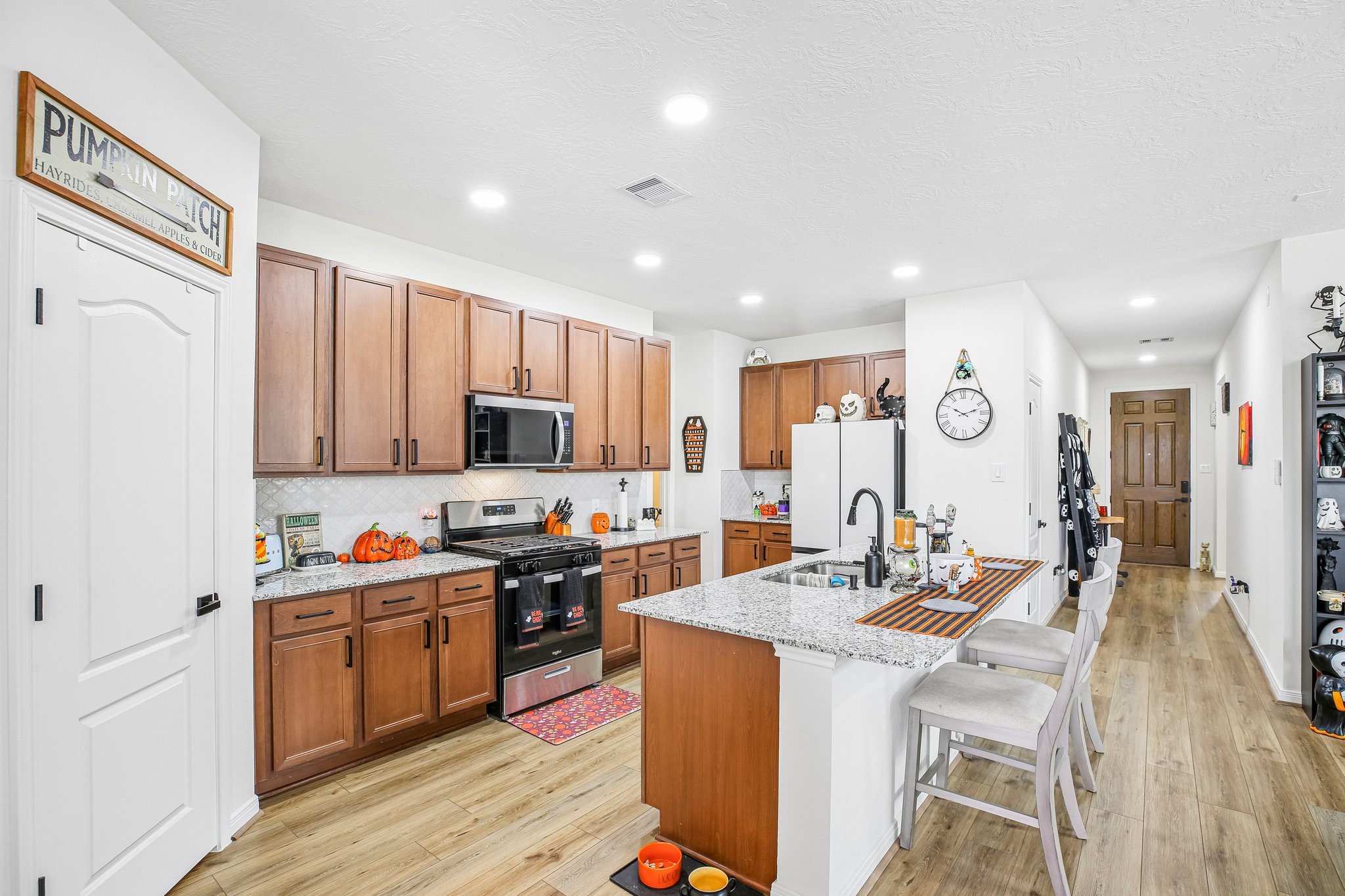 Kitchen refrigerator included. Spacious pantry.