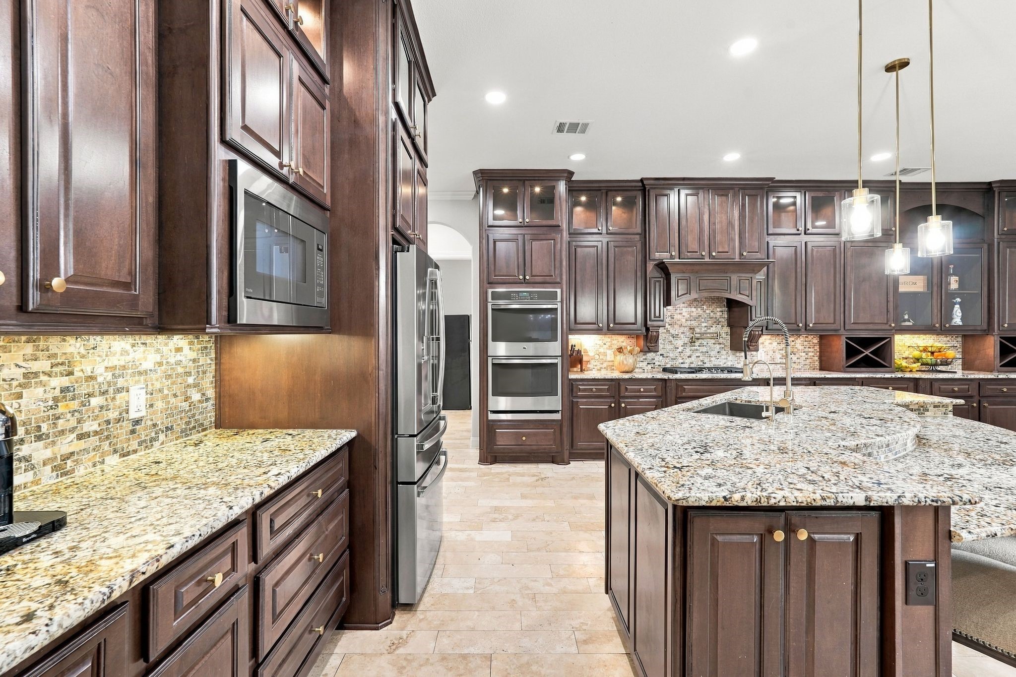 This kitchen is massiive and comes with a new dishwahser (2024), Stainless wine chiller (2024) and new refrigerator (2024) which all stay!