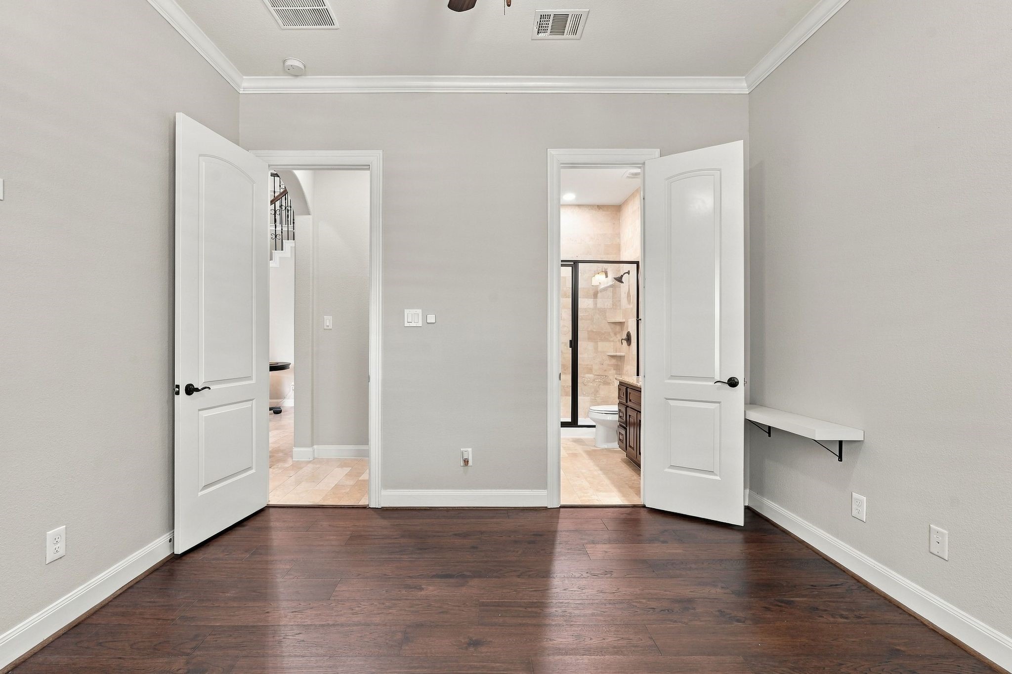 On the first floor is the second bedroom with hardwood floors and it's own ensuite bathroom.