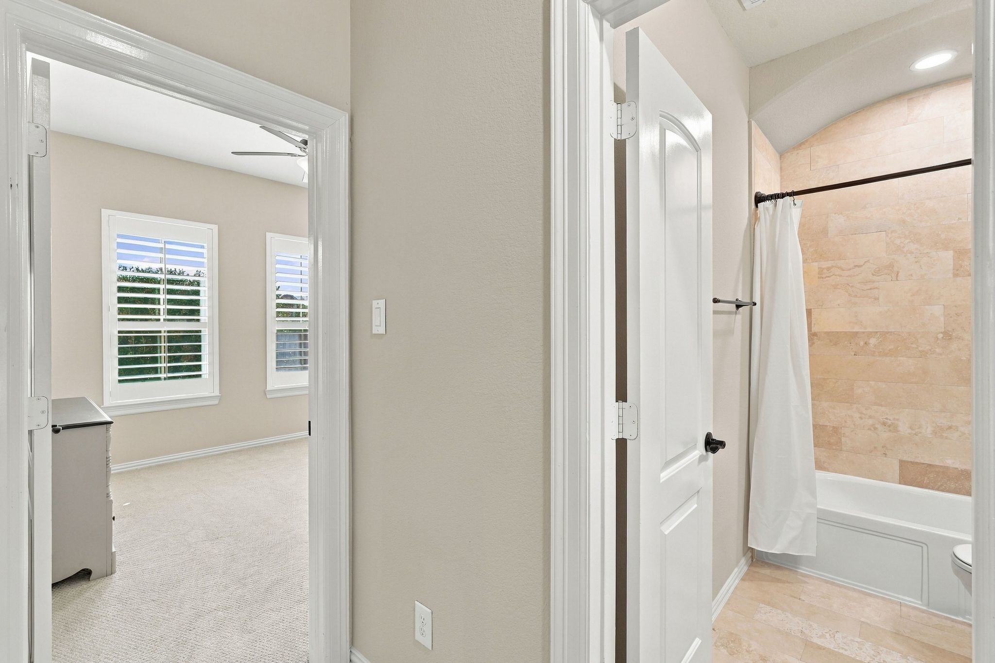 Looking into the third secondary bedroom adjectent to a full bathroom.