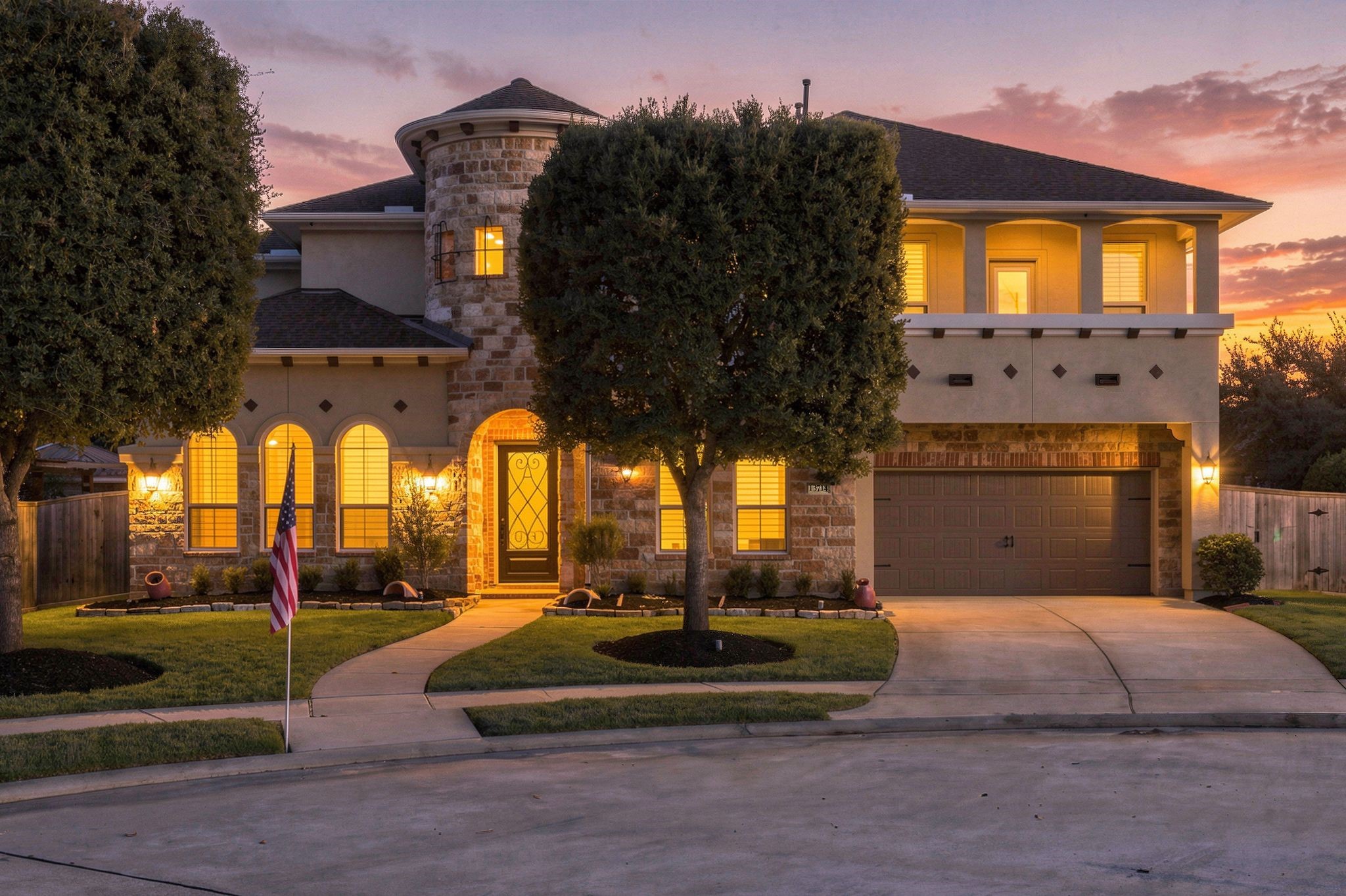 Stunning twilight exterior of this luxury two-story home in gated Wildwood at Northpointe, featuring beautiful stone and stucco architecture, arched windows, elegant exterior lighting, and manicured landscaping. Zoned to Tomball ISD! Stunning twilight exterior of this luxury two-story home in gated Wildwood at Northpointe, featuring beautiful stone and stucco architecture, arched windows, elegant exterior lighting, and manicured landscaping. Zoned to Tomball ISD!