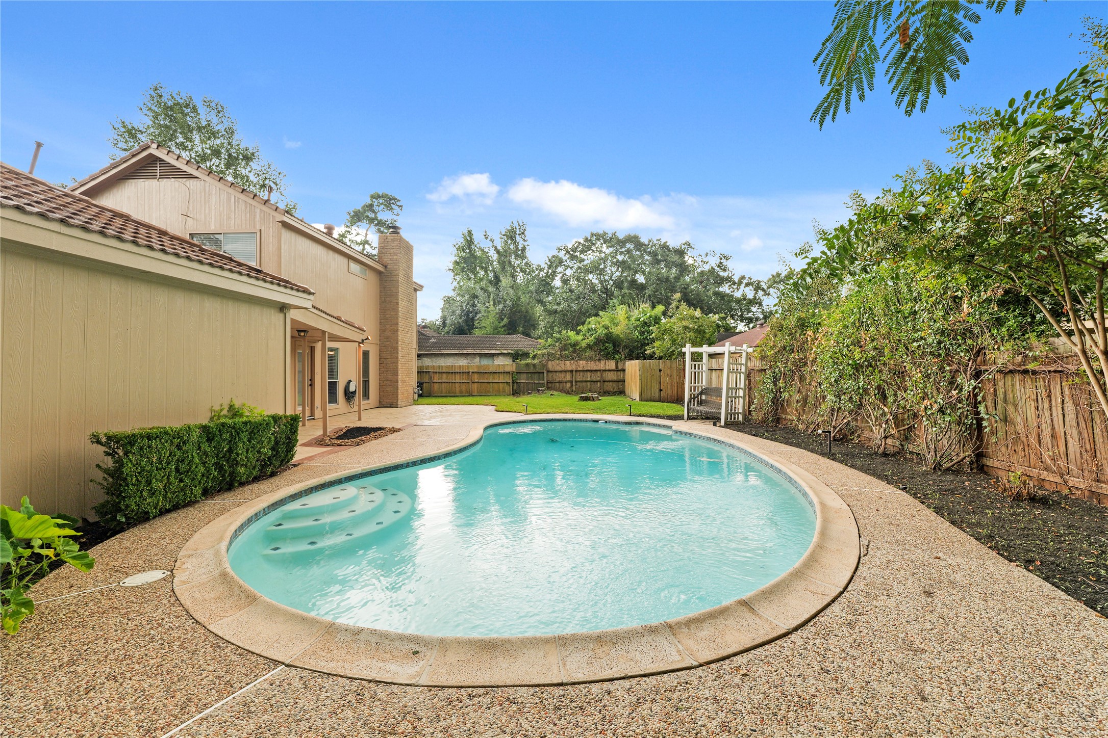 View of backyard and gorgeous pool
