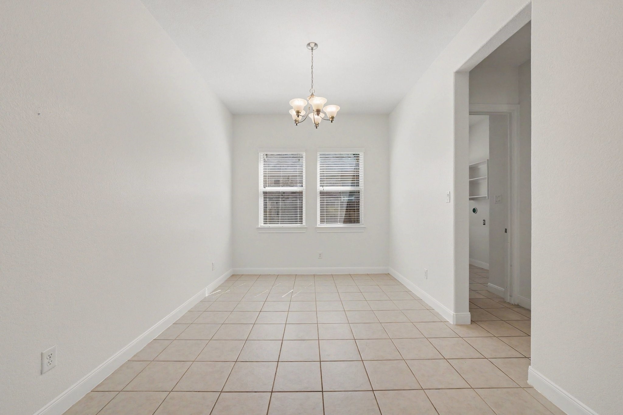Formal dining room off the main hallway with entry to the kitchen