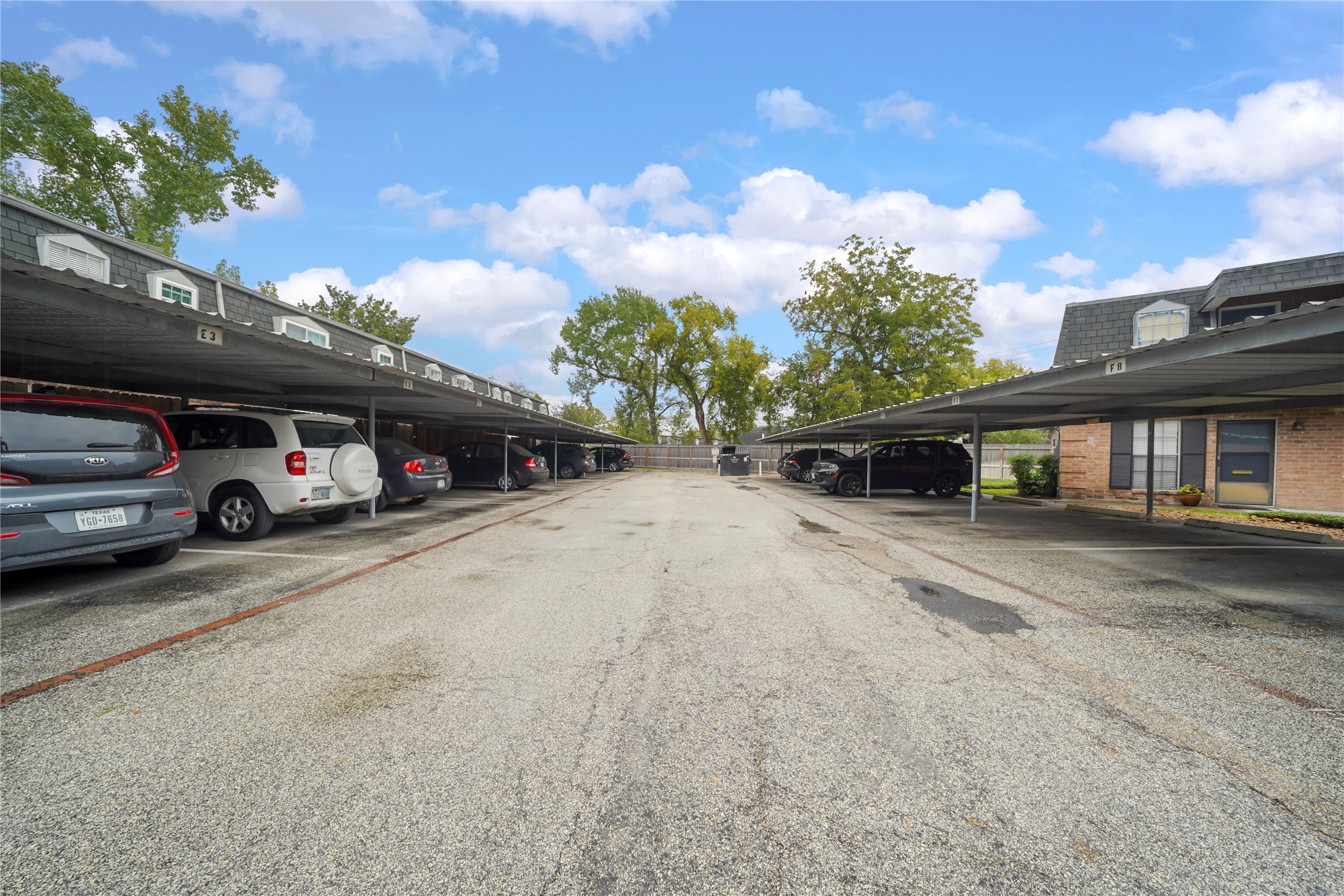 Dedicated resident parking featuring covered carport spaces for convenient, weather-protected vehicle storage.