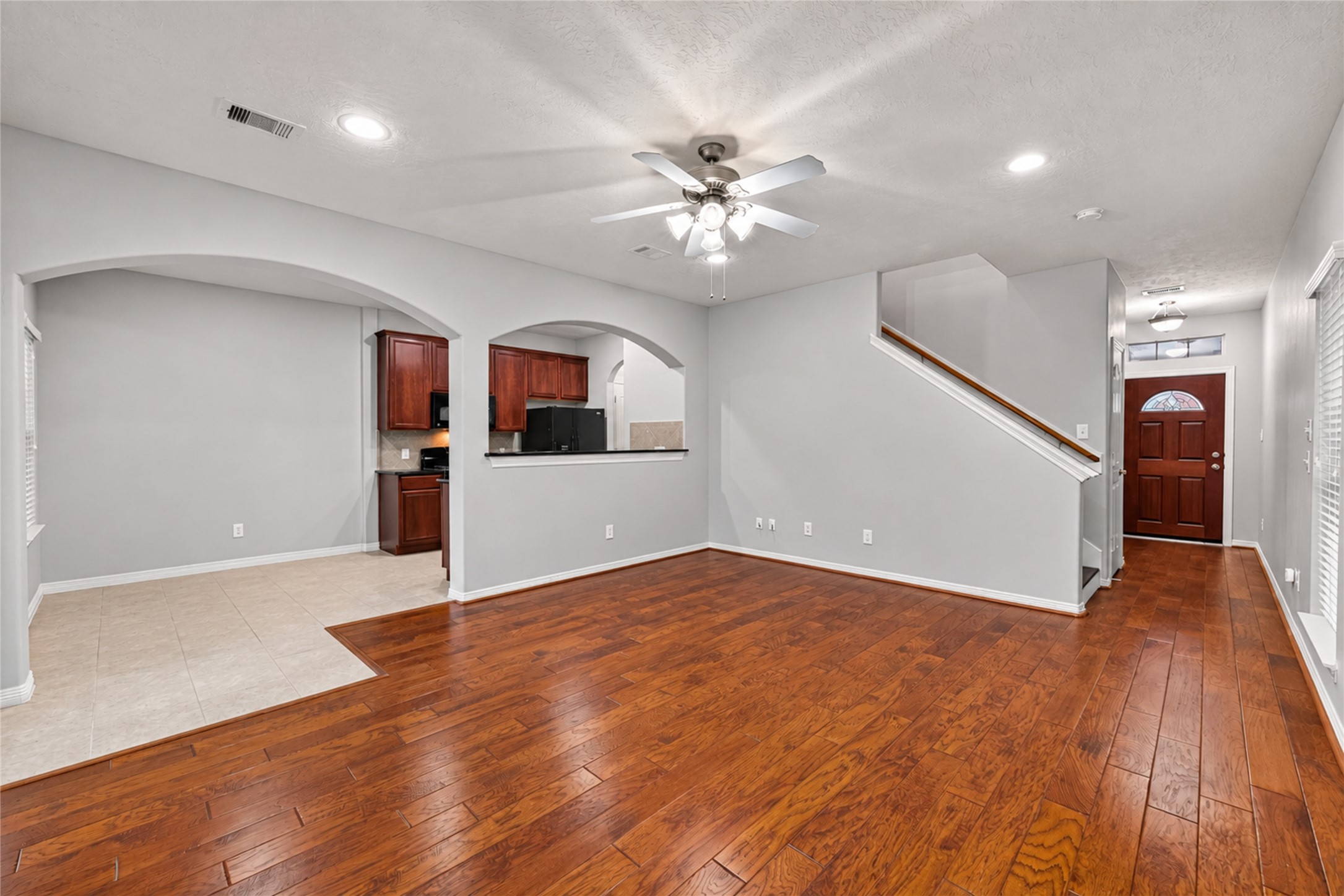 Living room open to kitchen and dining area.