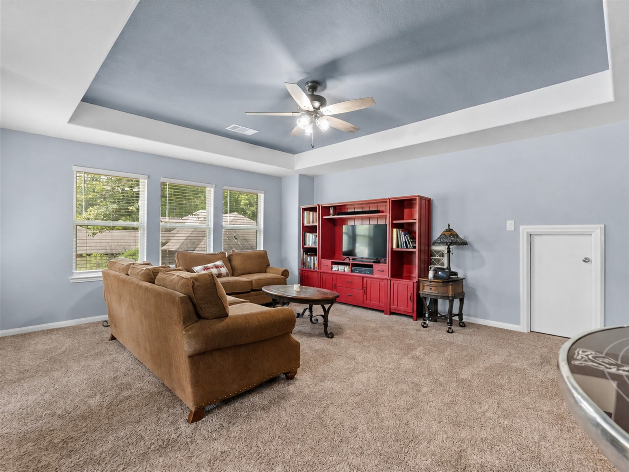 Natural light fills the spacious upstairs game room, creating an inviting place to relax and gather.