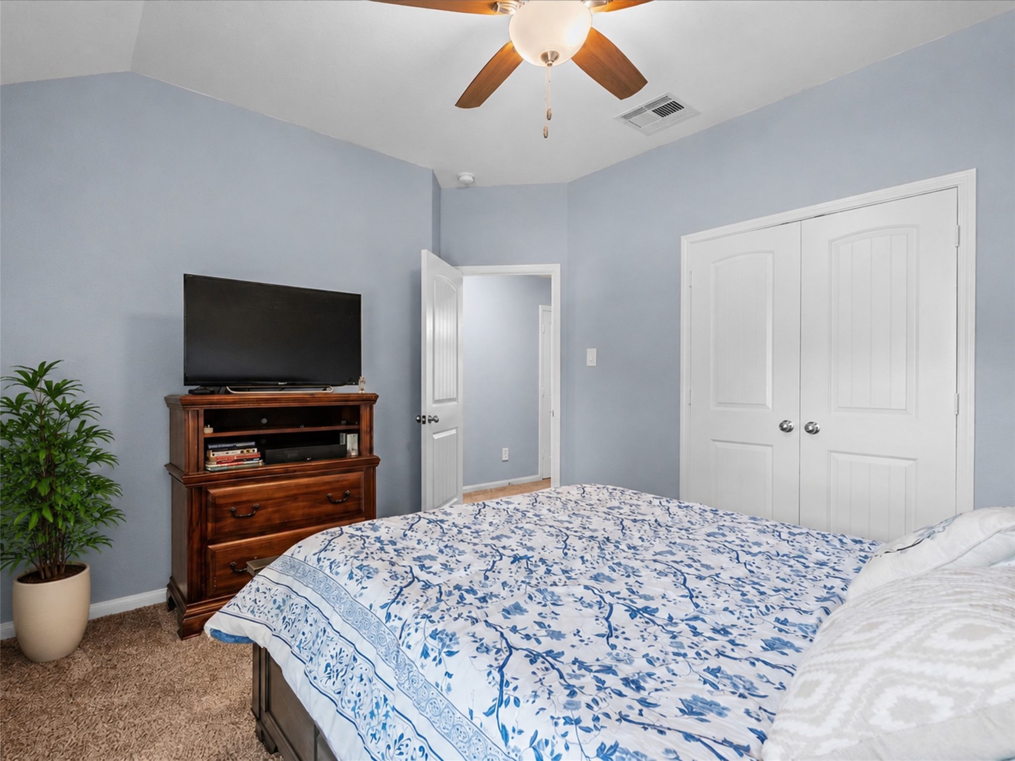 Another inviting secondary bedroom offers plenty of space, natural light and a comfortable place to unwind.