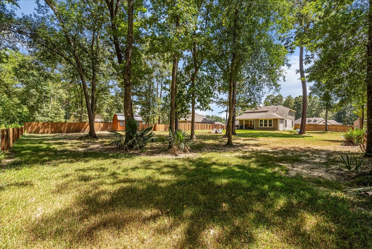 Mature trees create a peaceful backyard setting with plenty of shade, privacy and room to enjoy the outdoors.