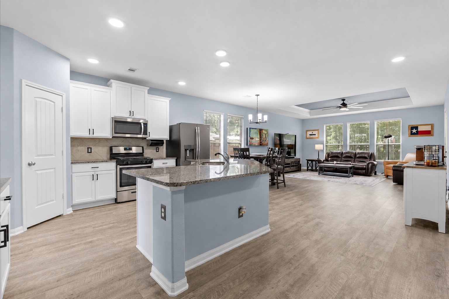 The spacious kitchen flows effortlessly into the dining and living areas, keeping everyone connected.
