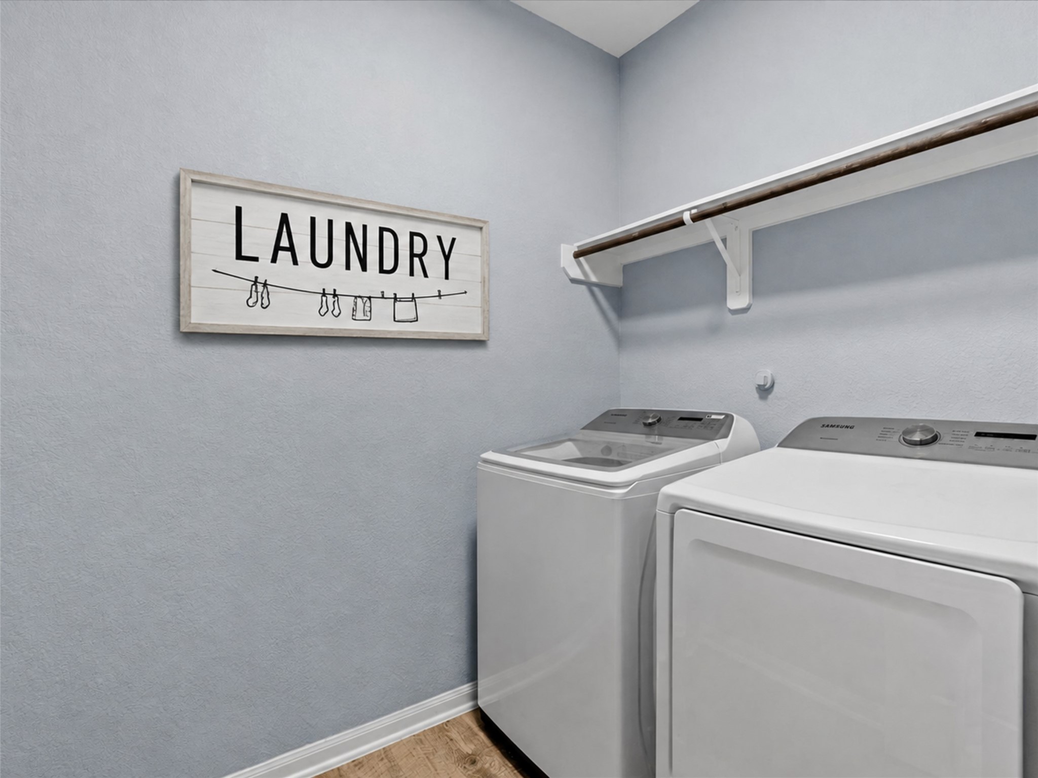 Dedicated laundry room provides convenient everyday functionality and extra storage space.
