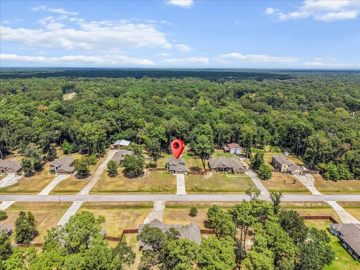 Surrounded by mature trees and open space, this peaceful setting feels tucked away while remaining close to city conveniences.