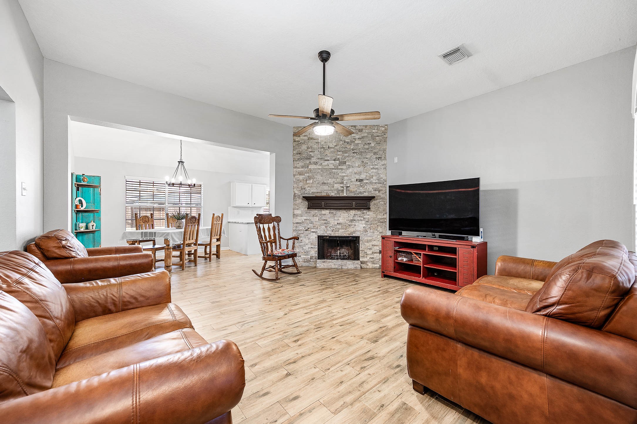 The hub of the home, beautiful stone fireplace, is the perfect centerpiece for family gatherings The hub of the home, beautiful stone fireplace, is the perfect centerpiece for family gatherings