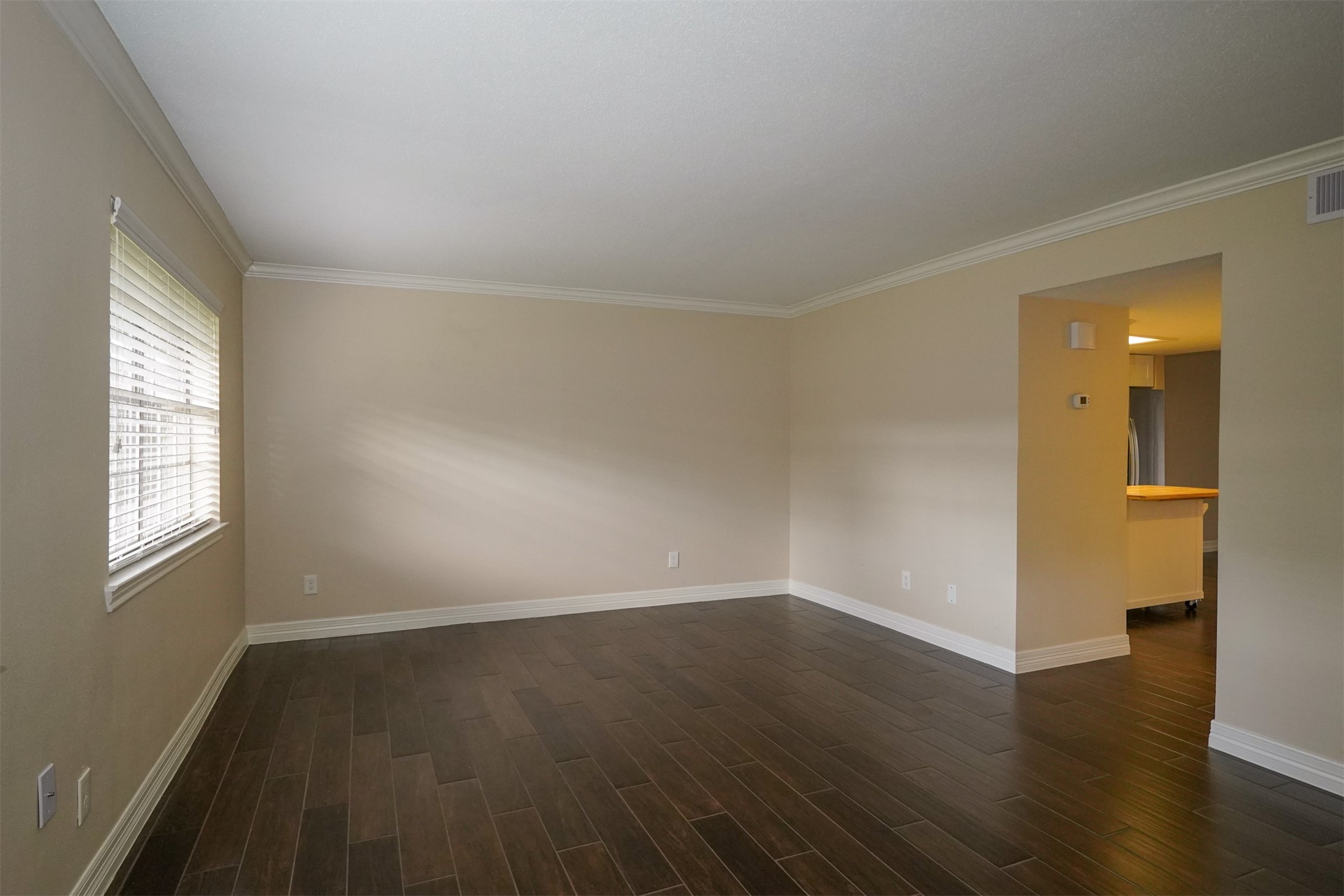 Entry to find the large living room & can be a dining room or home office