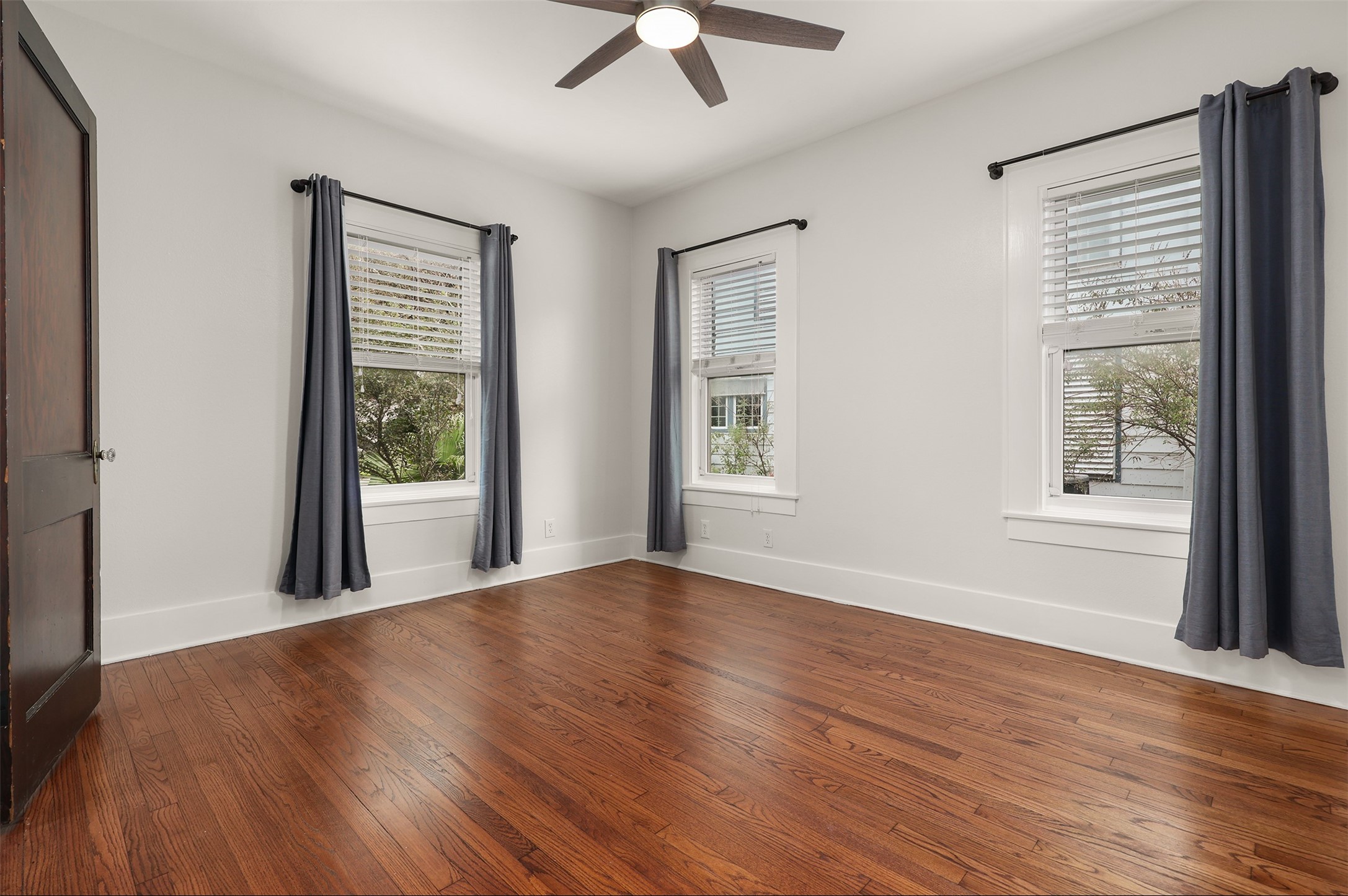 Spacious primary bedroom located on first floor with ensuite bathroom.