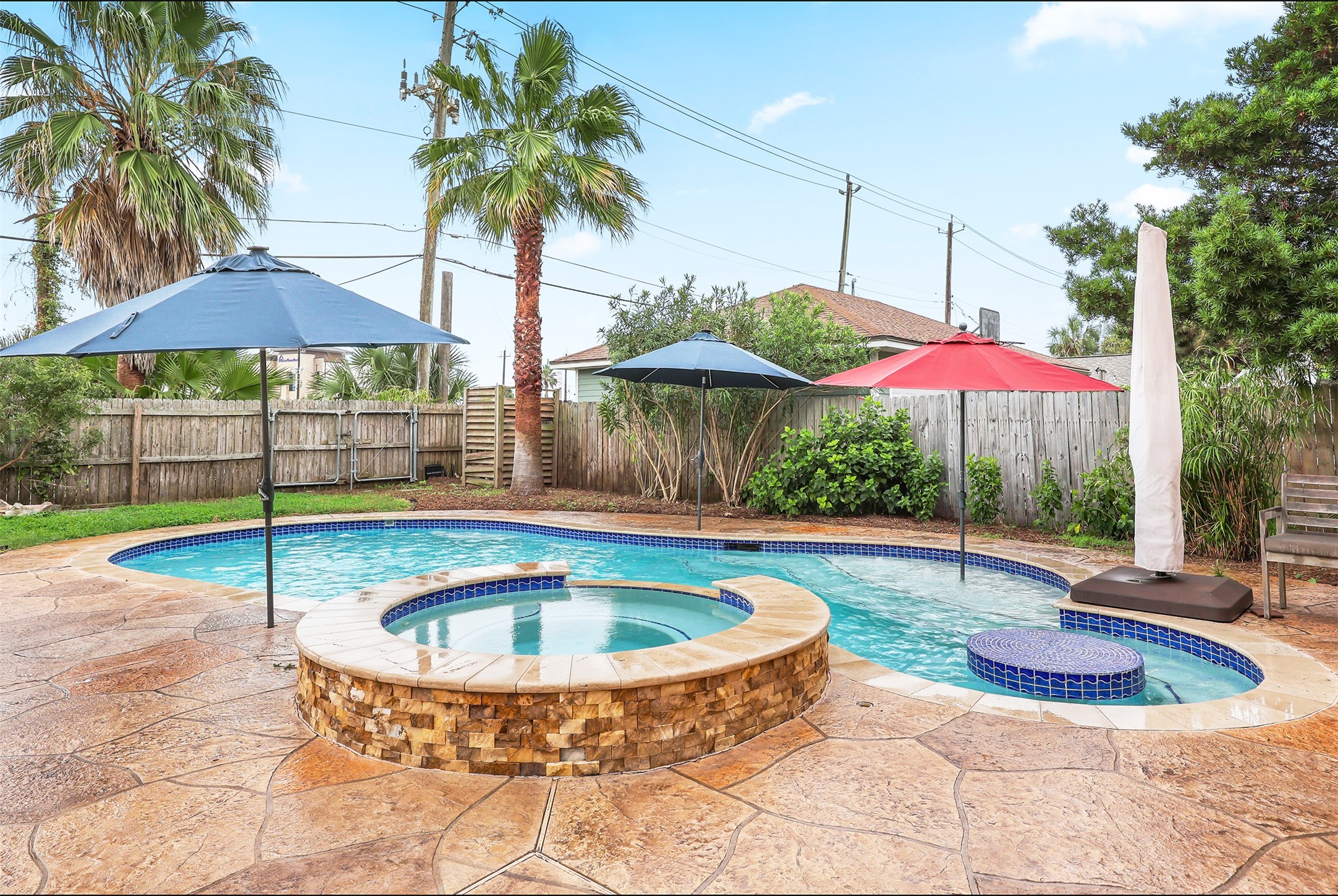 Inviting backyard oasis with stunning pool and spa.