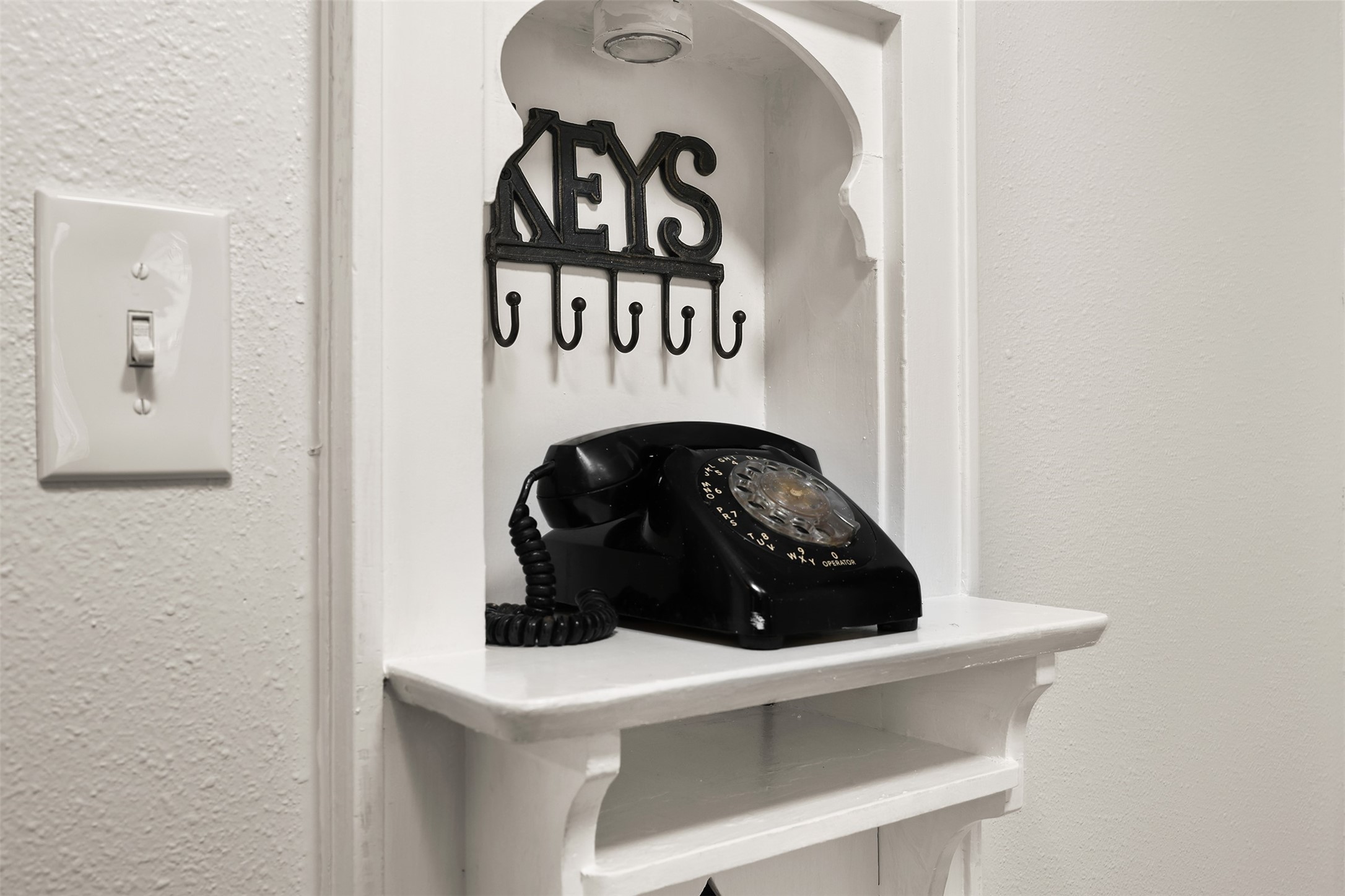Charming nook with vintage rotary phone.