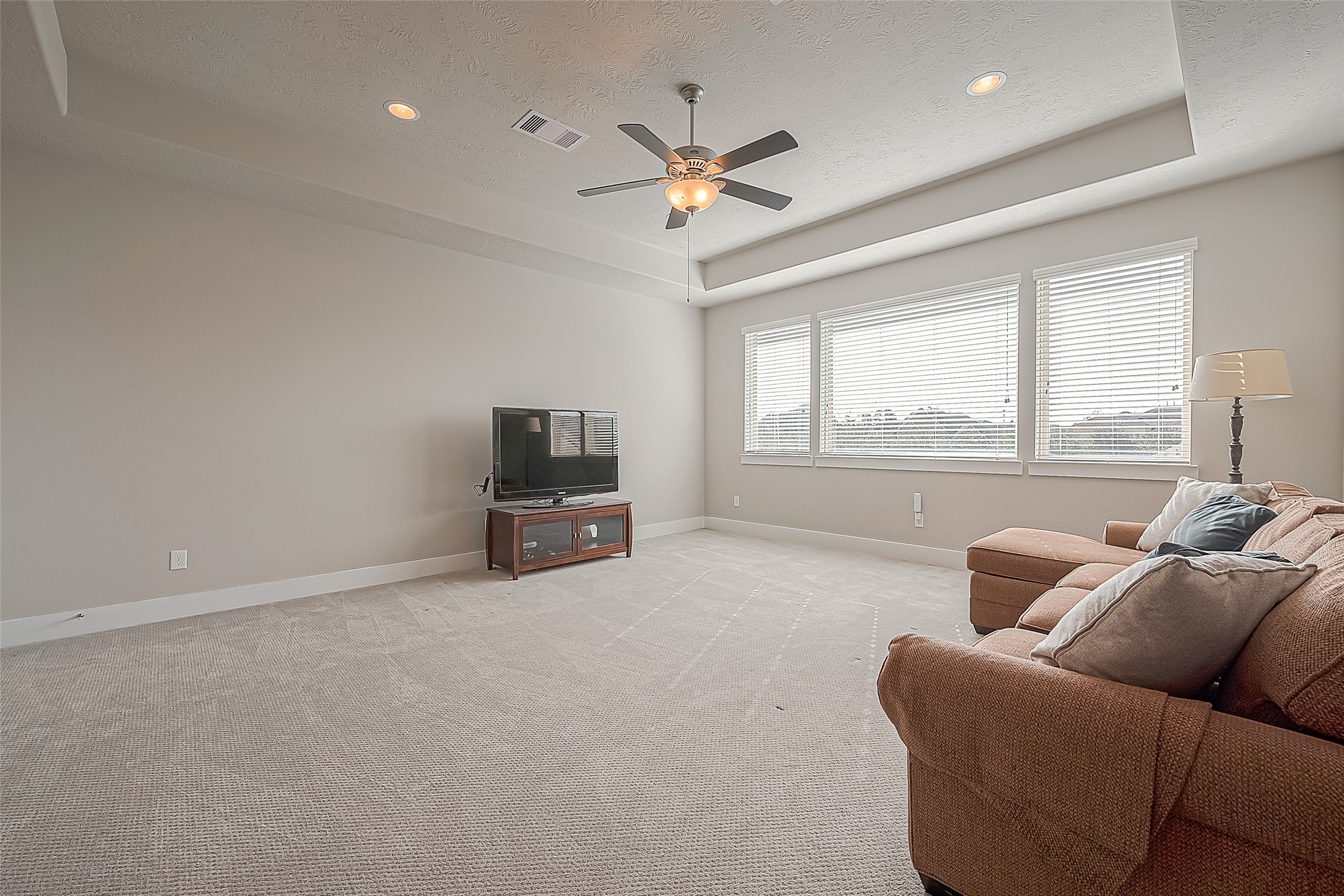 The expansive flex/game room upstairs. Refreshed NEW CARPET (not pictured).  Plenty of room for teen gaming, lots of seating, overnight sleepovers, ping-pong or pool table. It has a half bath.