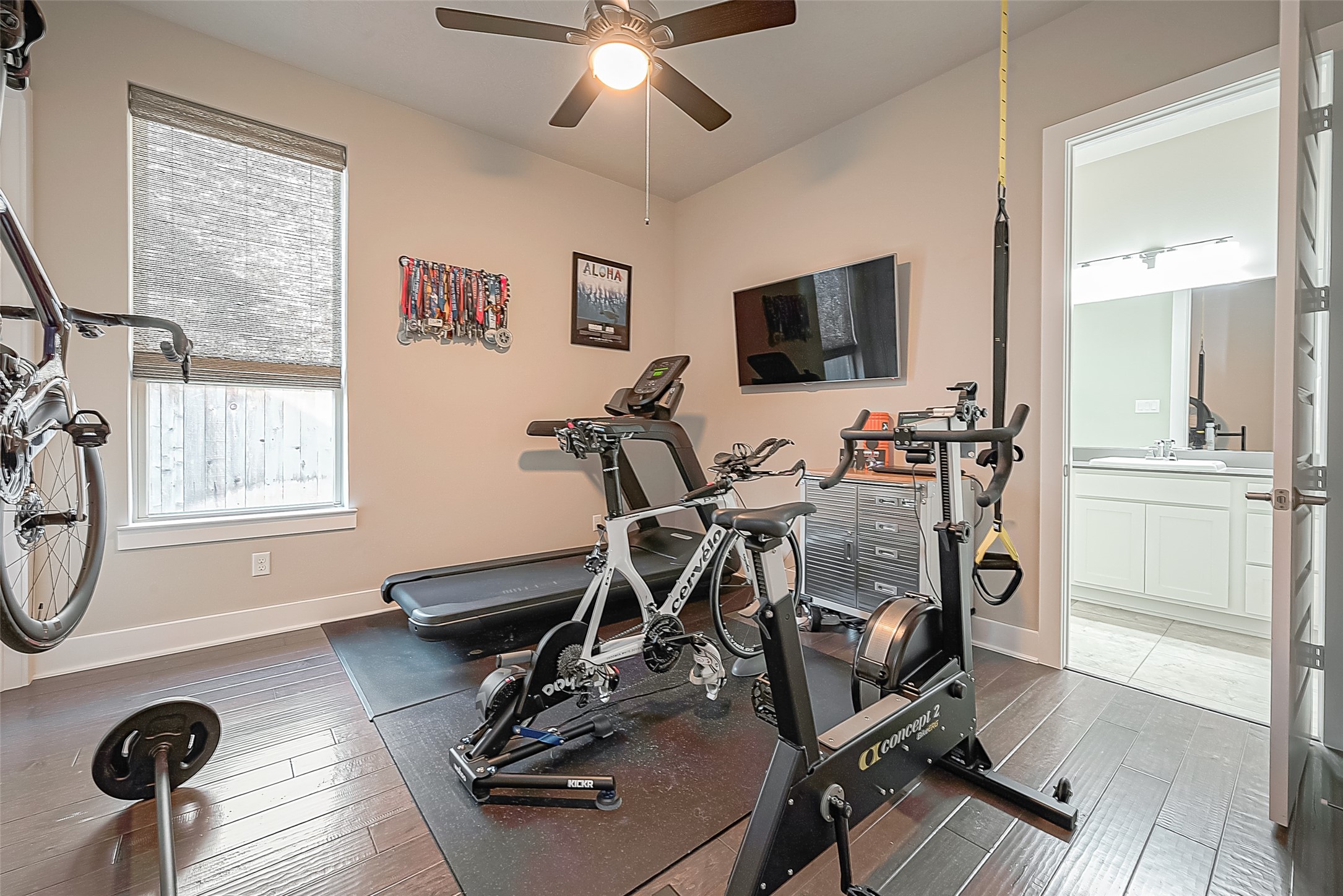 The secondary bedroom is currently used as a work-out room and has an en suite bath with shower.