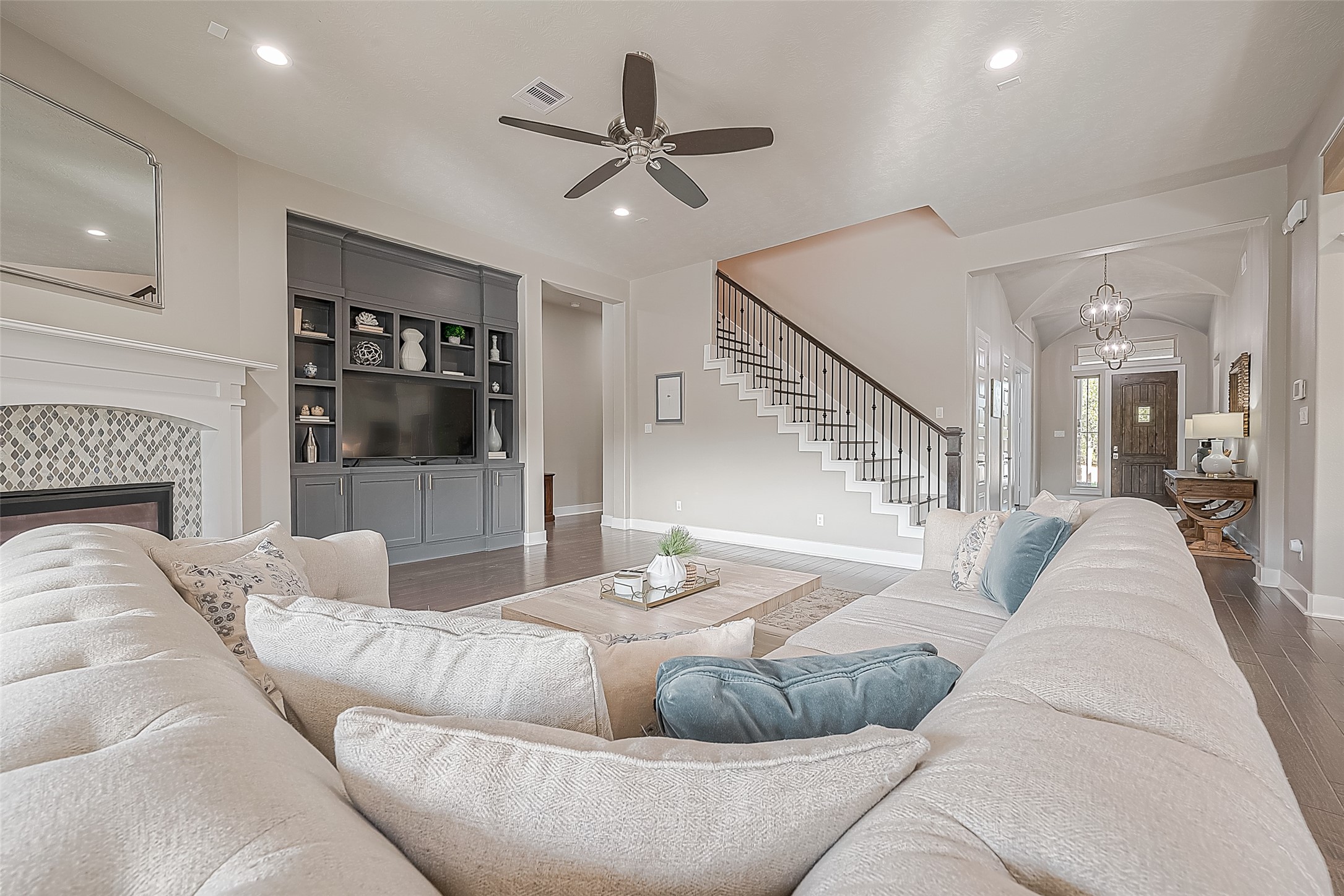 Alternate view of the living room and entry hall.