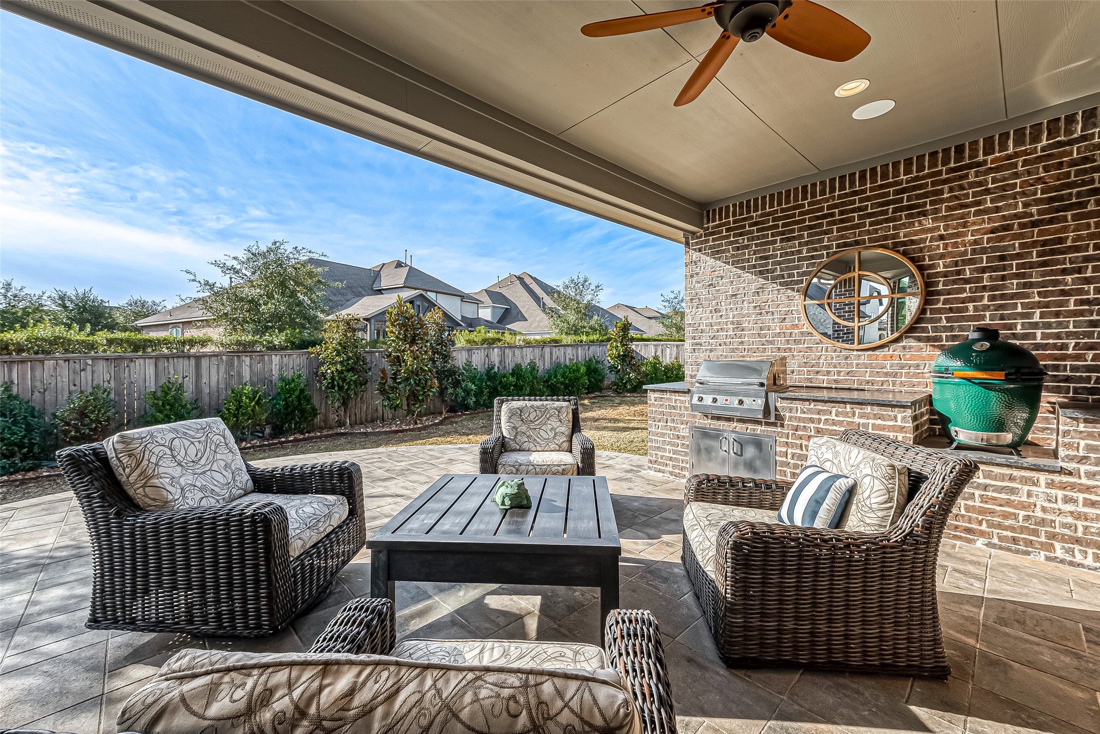 Recently added extended back patio and built-in outdoor kitchen.  Grill stays but green egg does not.