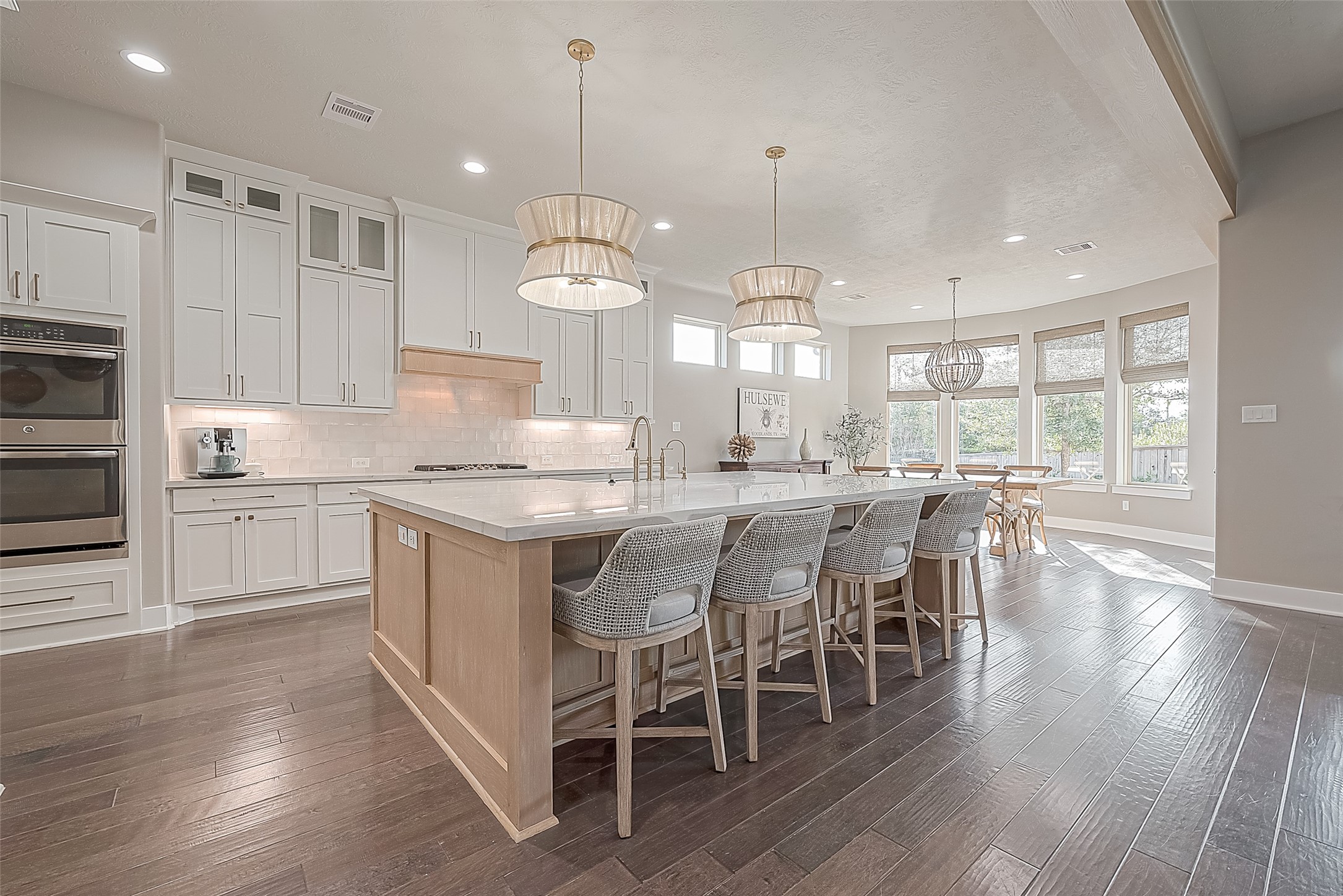 The large island offers additional seating and conversation with the one who is cooking the meals.