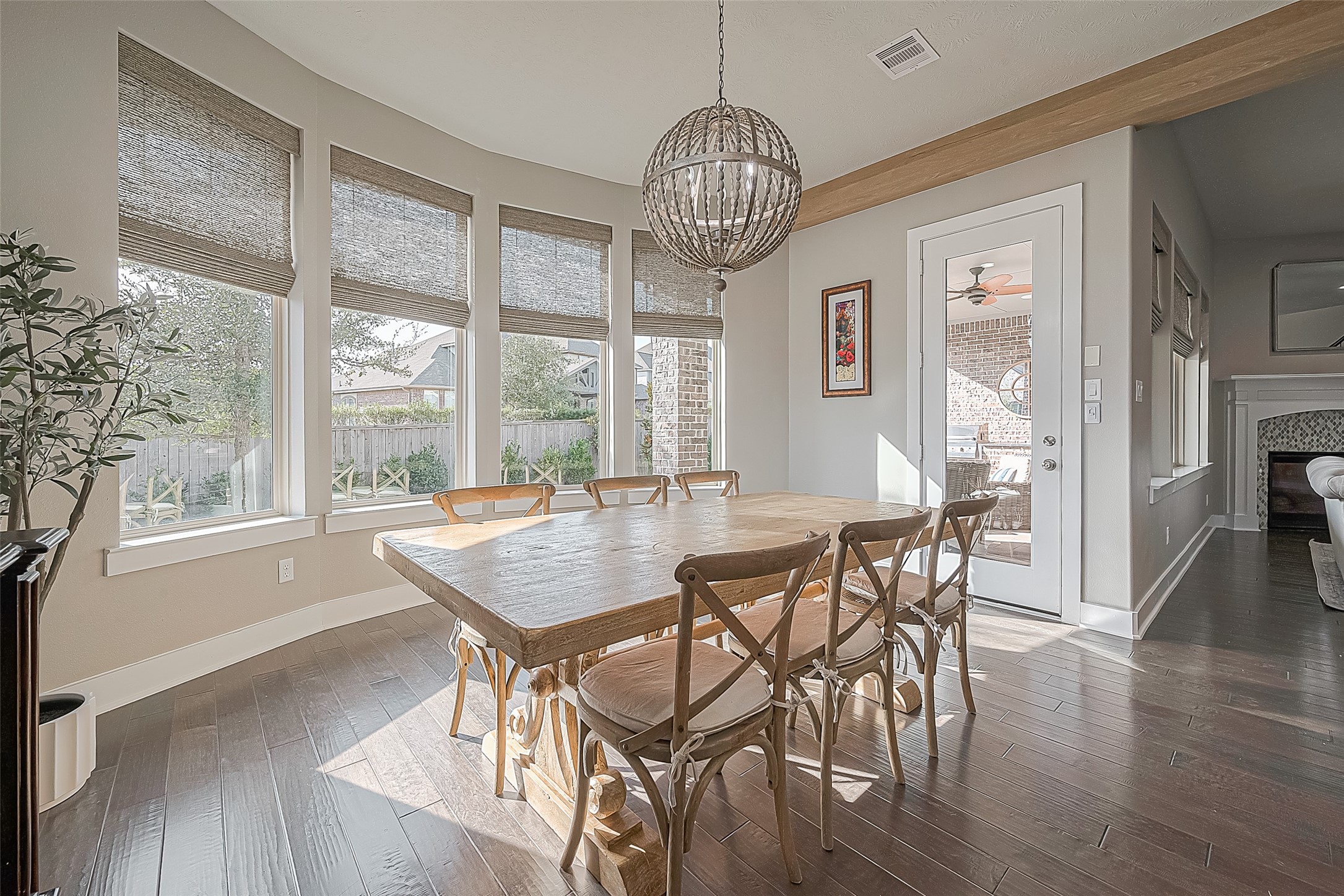 The spacious layout accommodates a large table, sideboard, and extra seating.