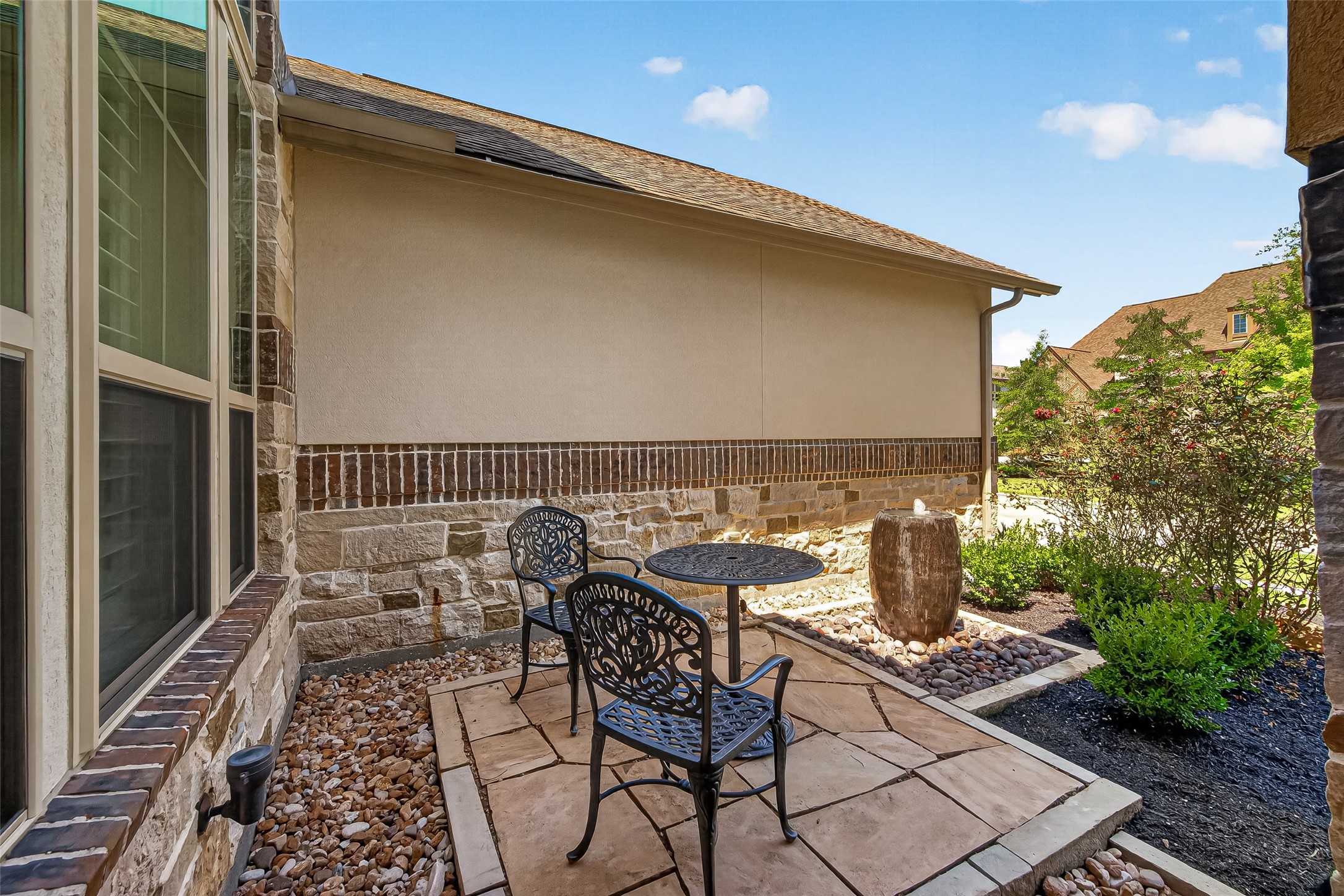 Water feature at the front door with area for seating