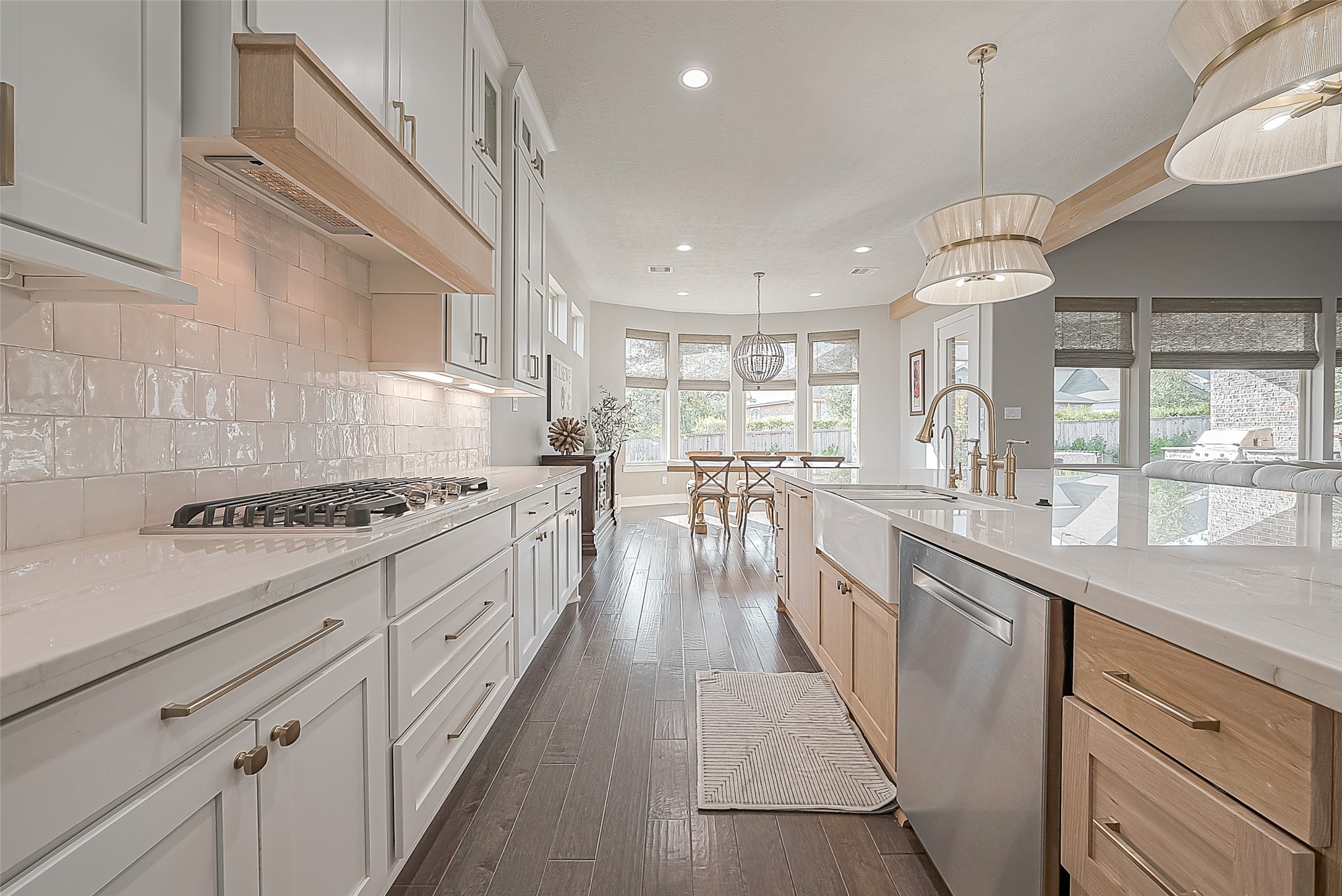 Rich wood and gold accents enhance the contemporary farmhouse aesthetic.
