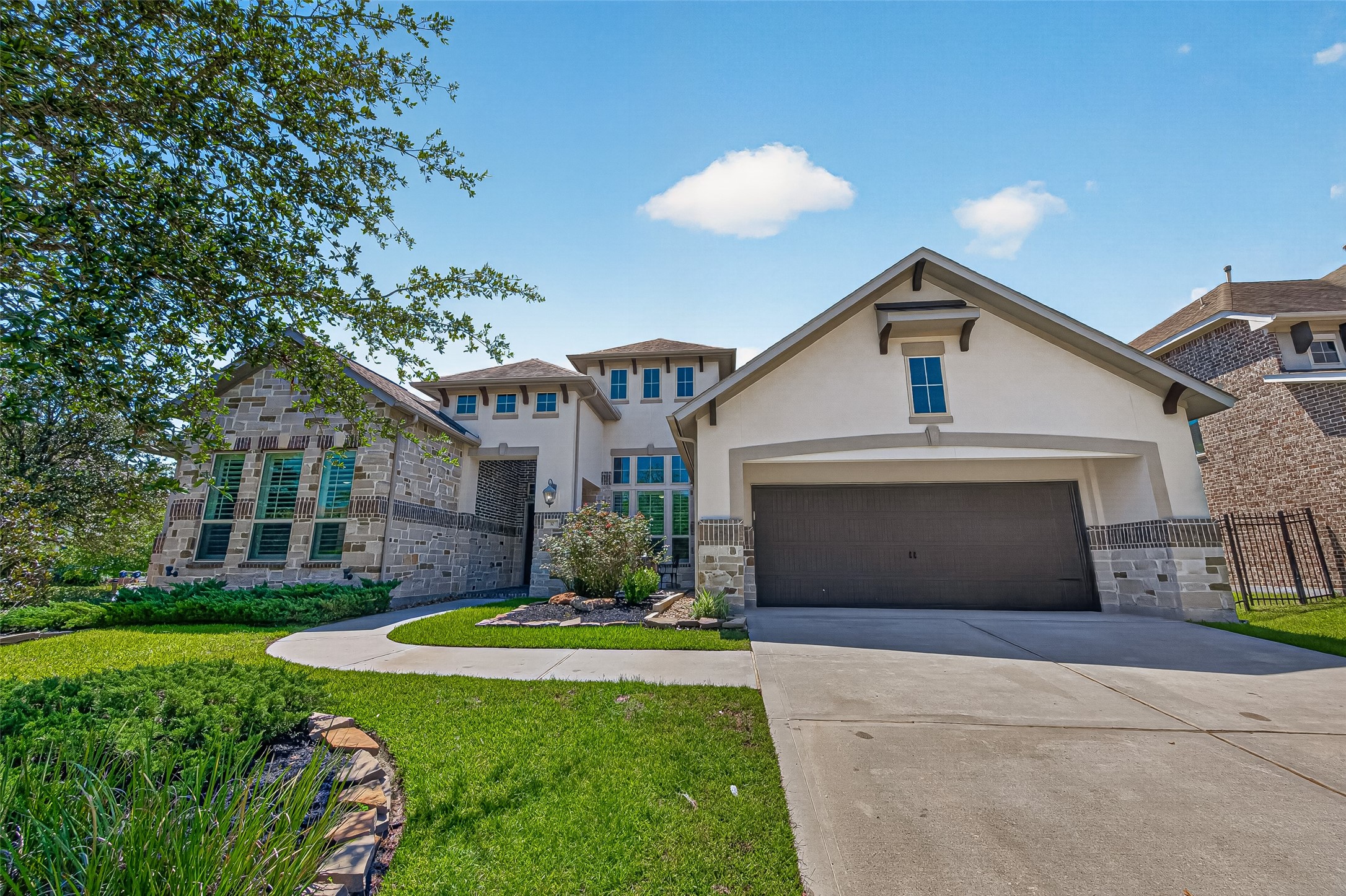 3 car tandem garage and plenty of room for guest parking on the double-wide driveway.