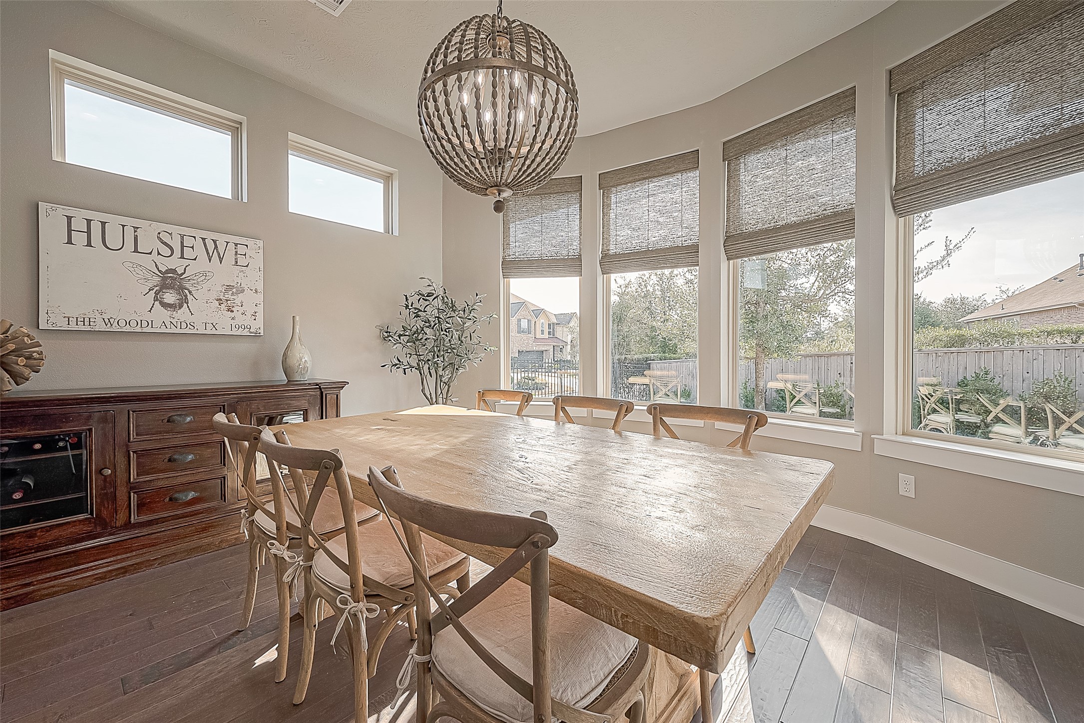 The dining area is bathed in natural light and provides ample space for large gatherings to comfortably sit and enjoy meals.