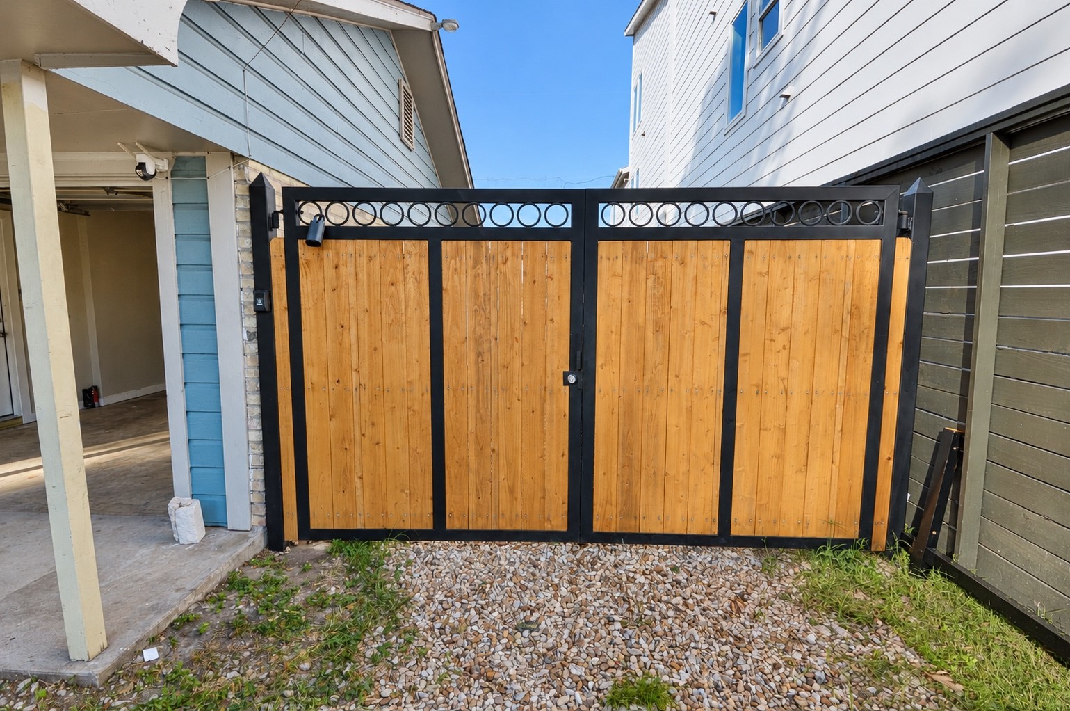 Gated entry to backyard and detached garage.