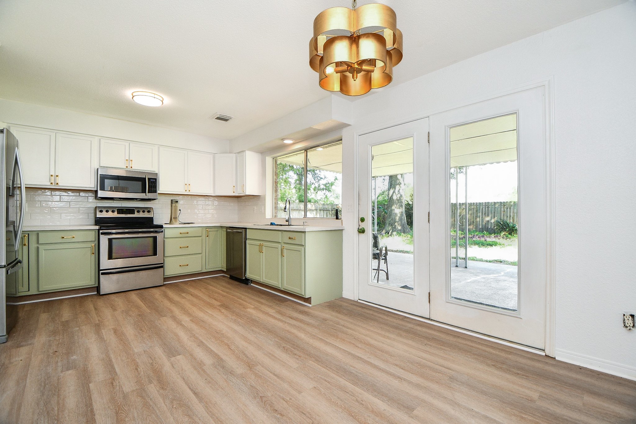 Kitchen has new cabinets, quartz counters, light fixture, paint and hardware. Kitchen has new cabinets, quartz counters, light fixture, paint and hardware.