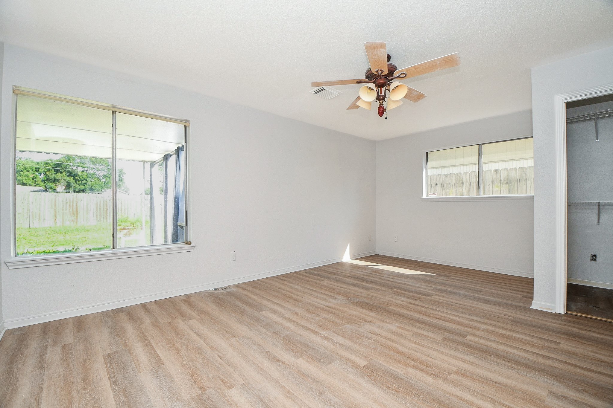 Master bedroom has fresh paint and new flooring.