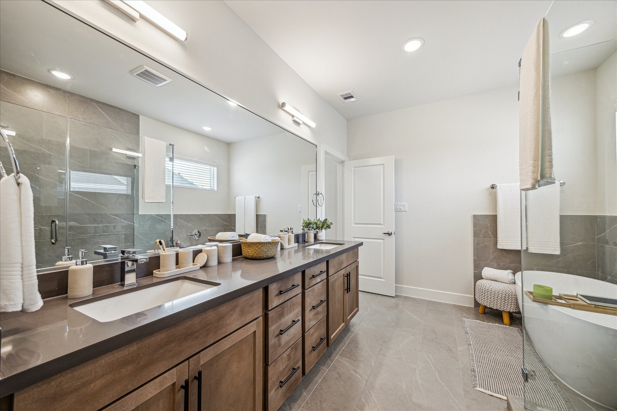 Representative photo showing the communitys model home primary bathroom. Layout and selections may vary. Representative photo showing the communitys model home primary bathroom. Layout and selections may vary.