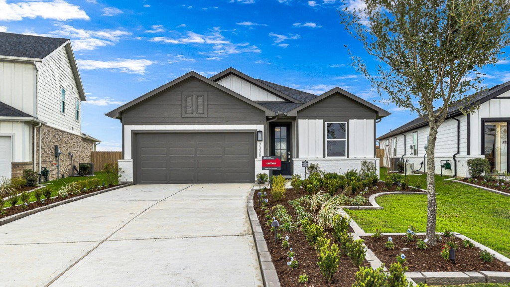 Rock lined landscaped beds are pristine adding beautiful curb appeal.