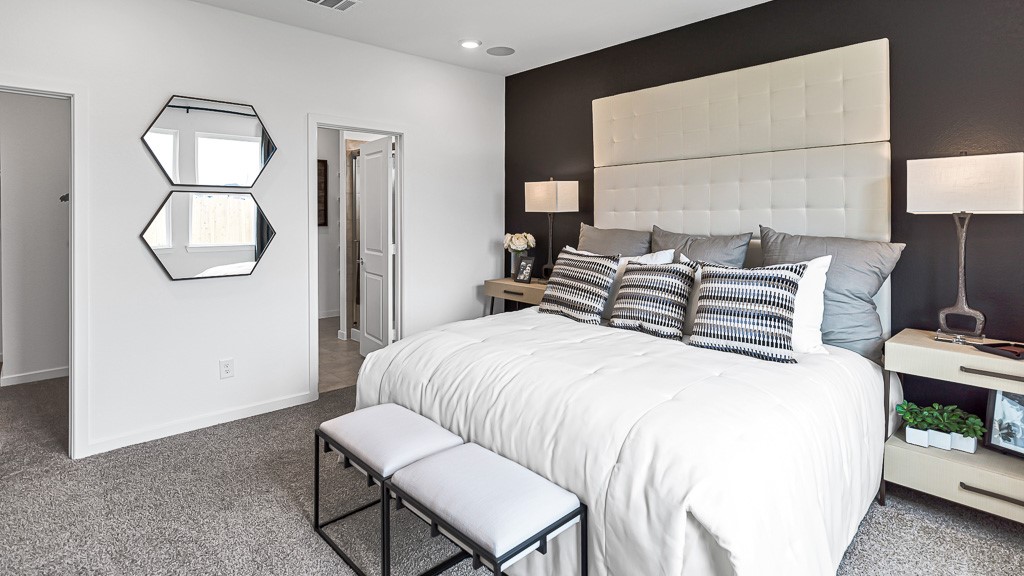 Primary suite has an ensuite bathroom and walk-in closet.