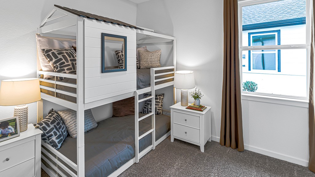 Bedroom 3 has appealing designer white walls and premium warm gray carpeting.