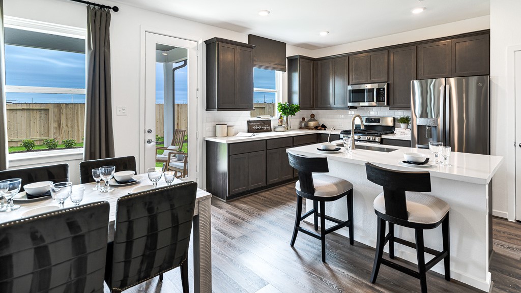 Open to the kitchen is the sought after layout for dining room, with convenient proximity to counter seating at kitchen island.