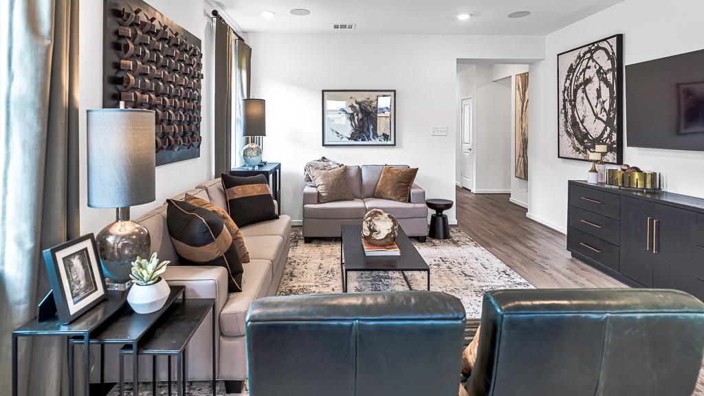 Fabulous family room is spacious with a place for everyone to sit, relax, and enjoy conversation or movies.