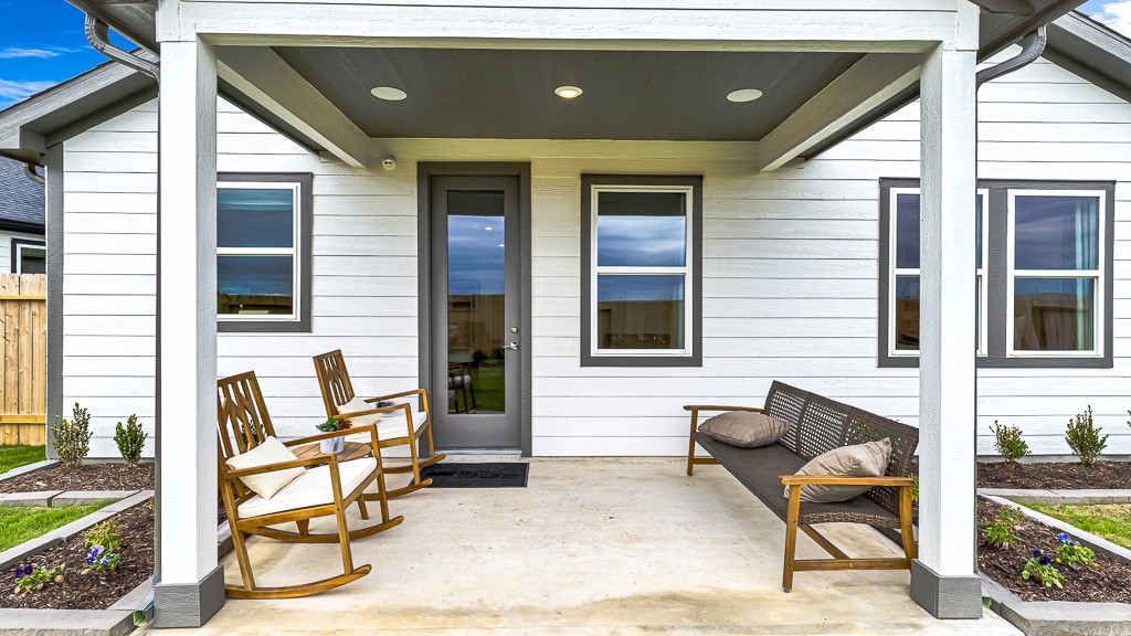 Covered lanai in backyard is perfect to enjoy outdoor lounging.