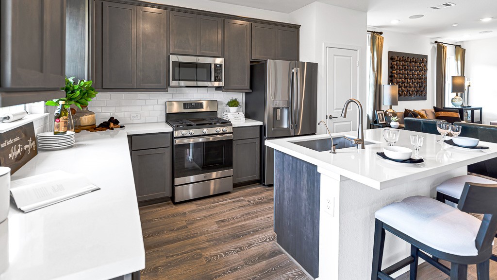 Sleek stainless steel premium appliances are the perfect choice in this kitchen.