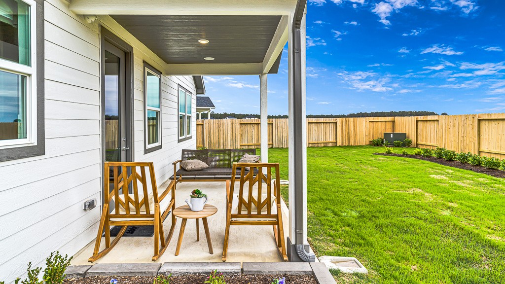 Painted slatted ceiling with recessed lighting adds upscale style to lanai.