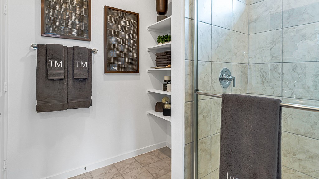 Recessed open shelves are perfect for towels, storage and decor.