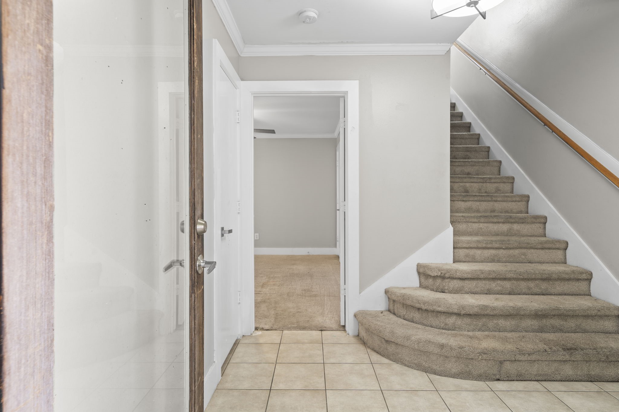 The foyer introduces the home with a clean, defined entry and a sense of separation from the main living areas above. It creates a natural transition into the three-story layout.