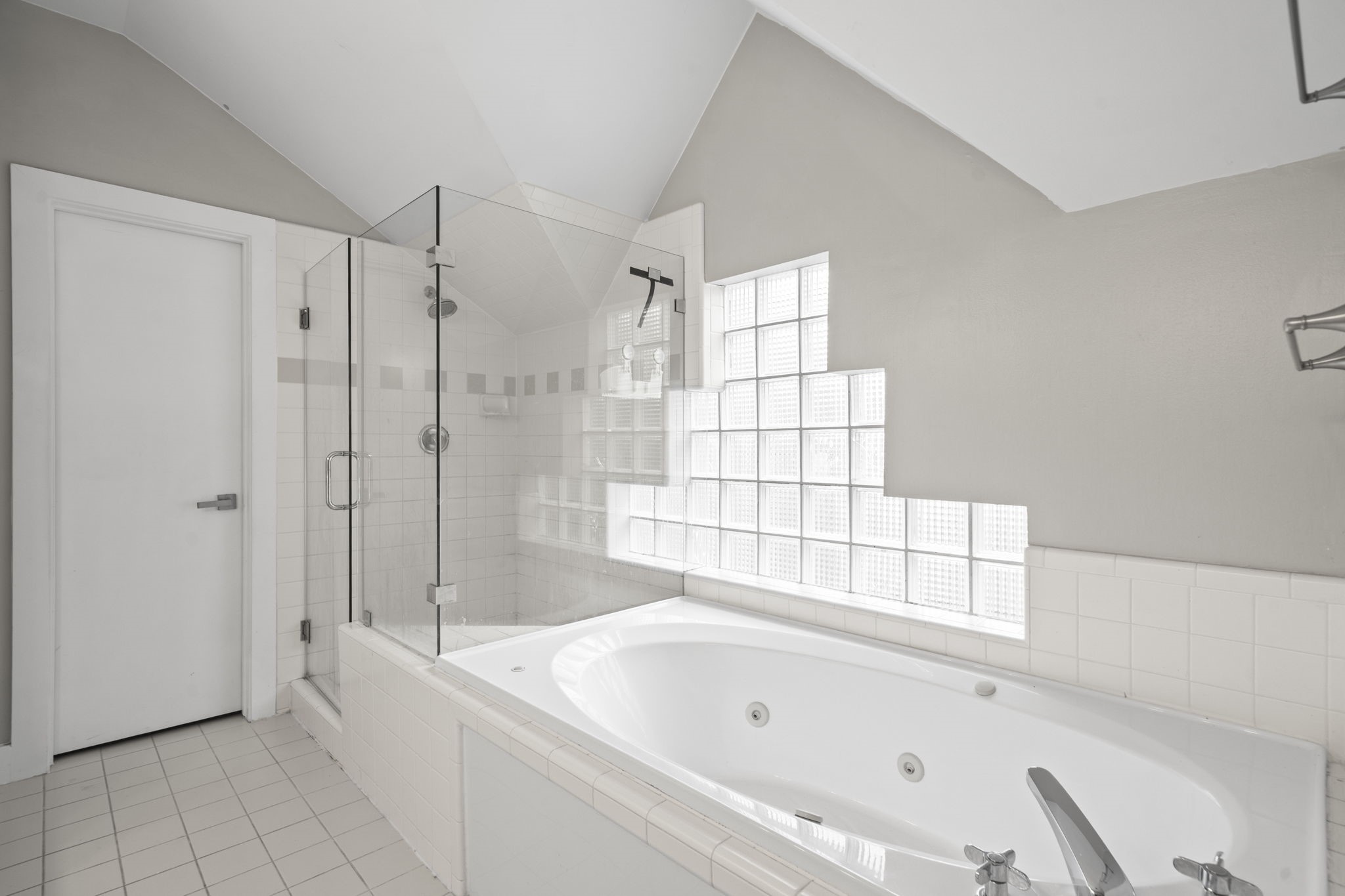 The ensuite bath gives the primary suite a more elevated feel, with separate spaces for getting ready, showering, and relaxing. The jetted tub adds a quiet touch of comfort at the end of the day.