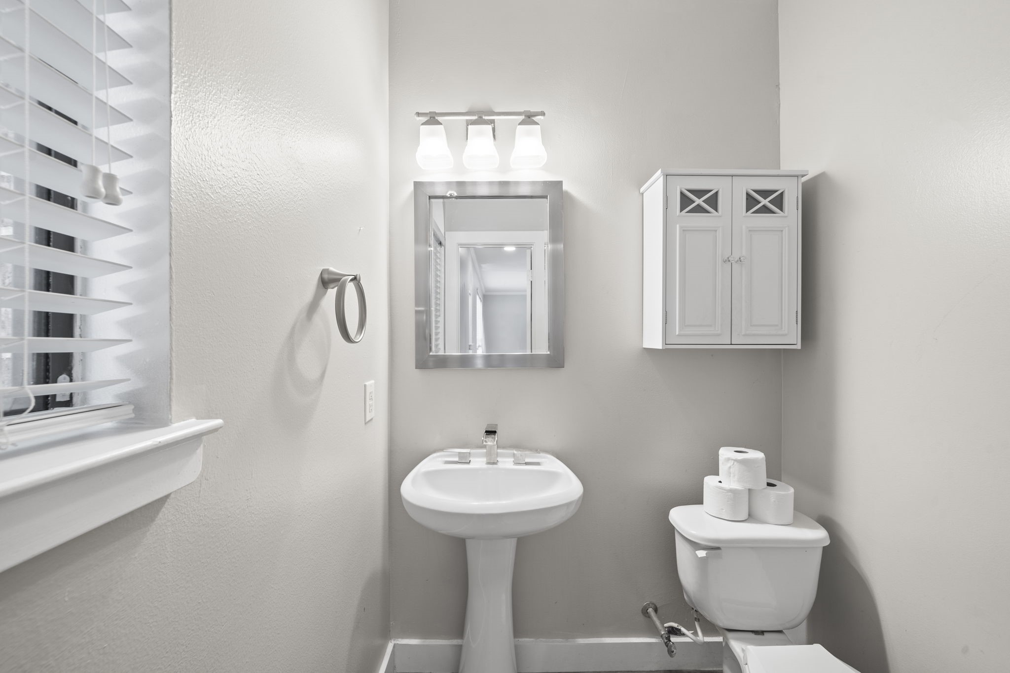 The second-floor half bath adds convenience right where it matters most. It keeps the main living and entertaining level complete without interrupting the flow of the home.