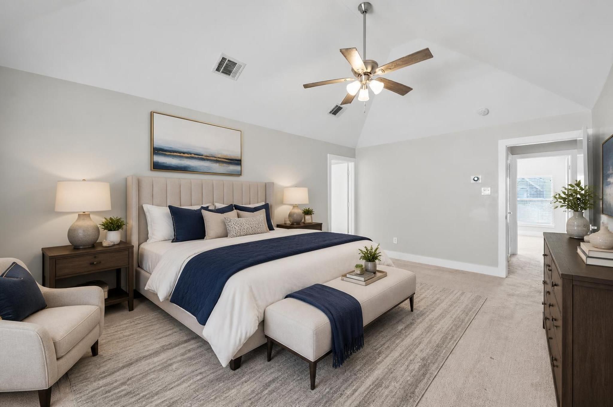 The primary bedroom sits privately on the third floor, creating a quiet retreat above the main living spaces. Its generous size, soft natural light, and calm feel make it a comfortable place to unwind. Virtually staged.