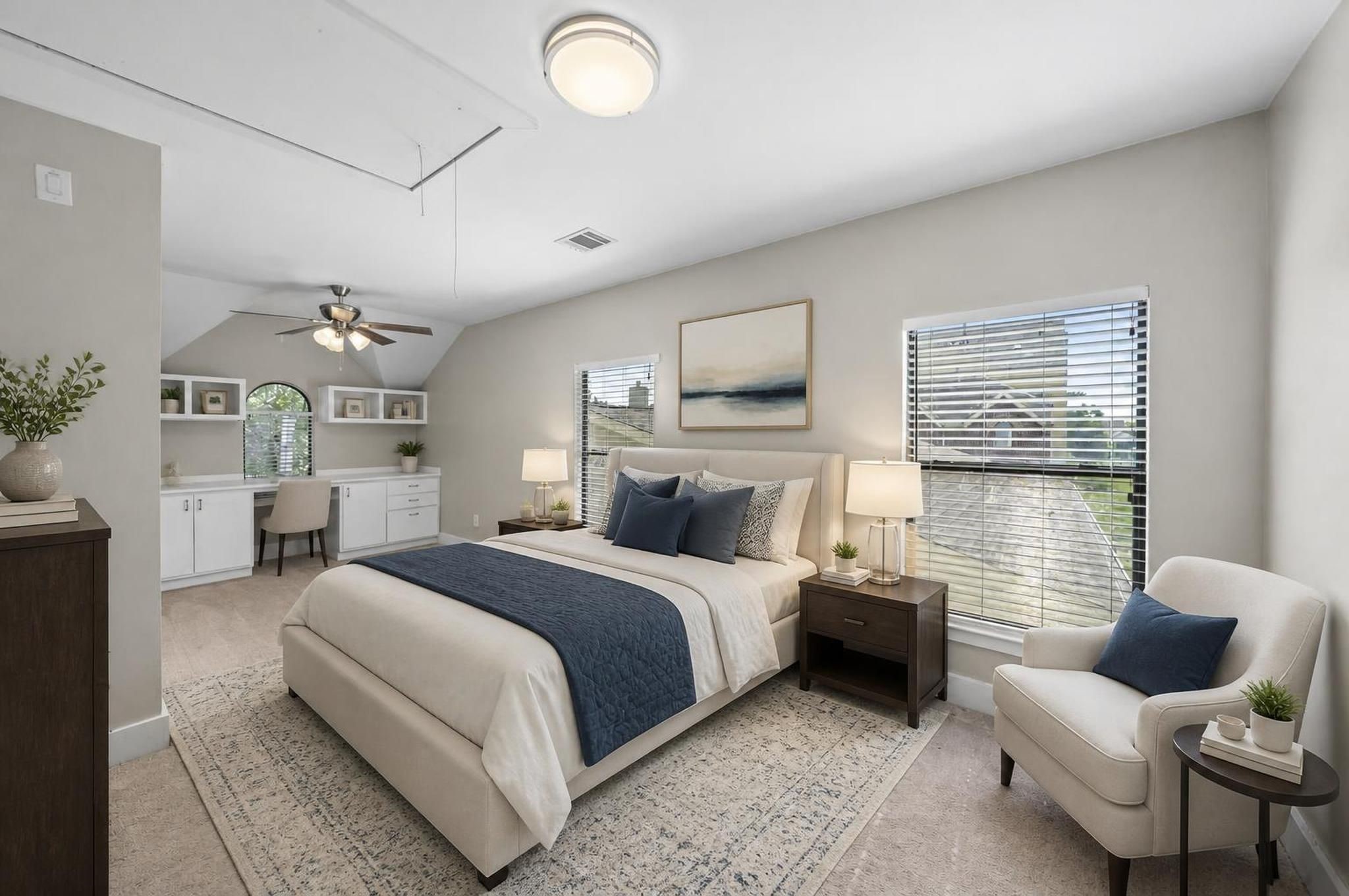 The upstairs secondary bedroom offers a bright and flexible space on the same level as the primary suite. It can easily become a bedroom, office, nursery, or quiet lounge. Virtually staged.