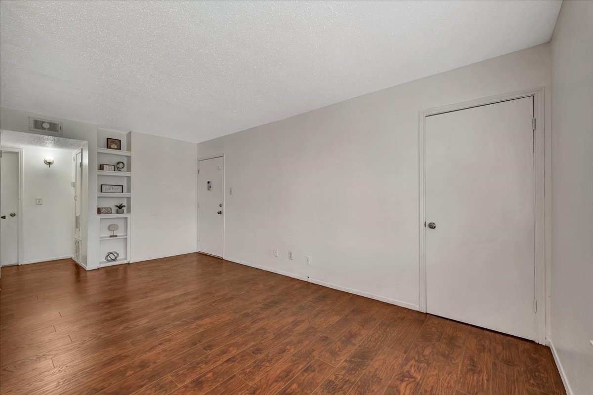 Just a few feet to the right of the entry, a generously sized walk-in closet provides ample storage for all your needs.